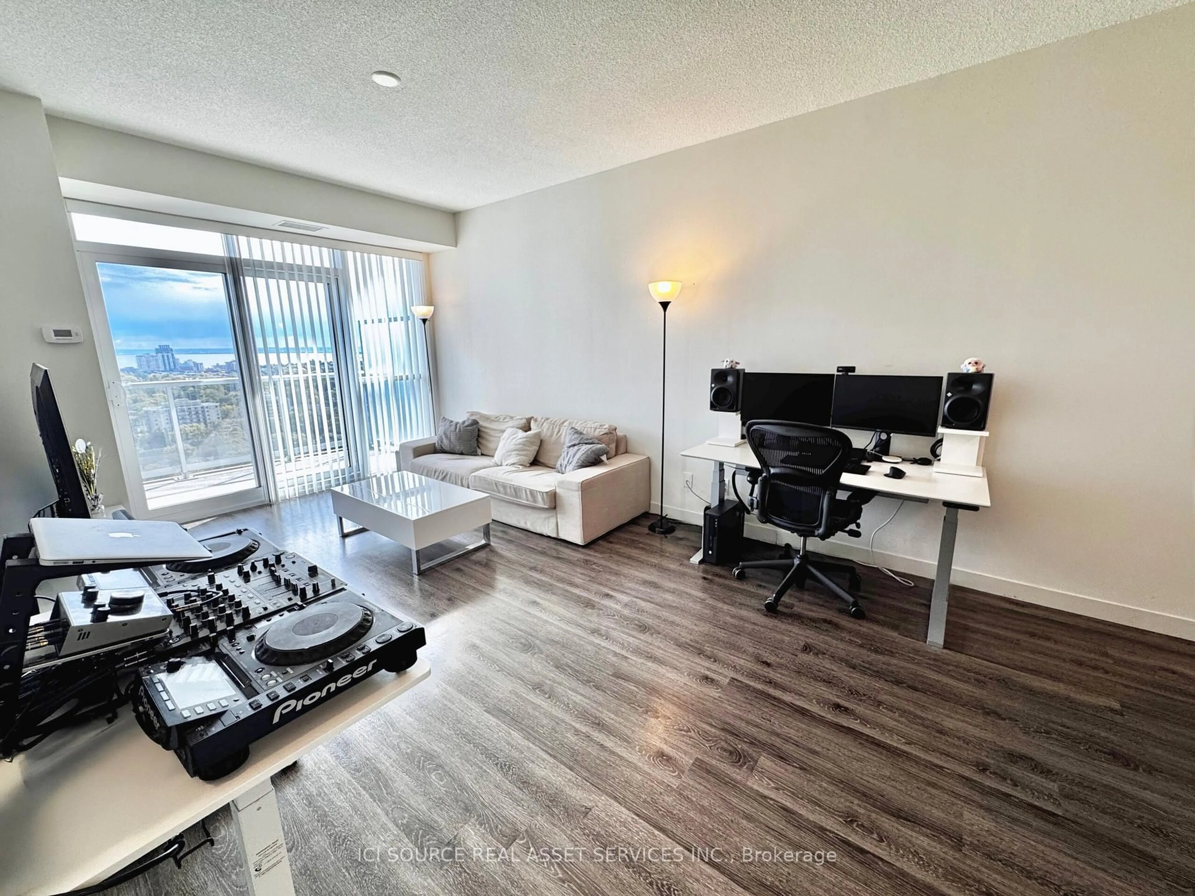 Living room with furniture, wood/laminate floor for 2081 Fairview St #1903, Burlington Ontario L7R 0E4