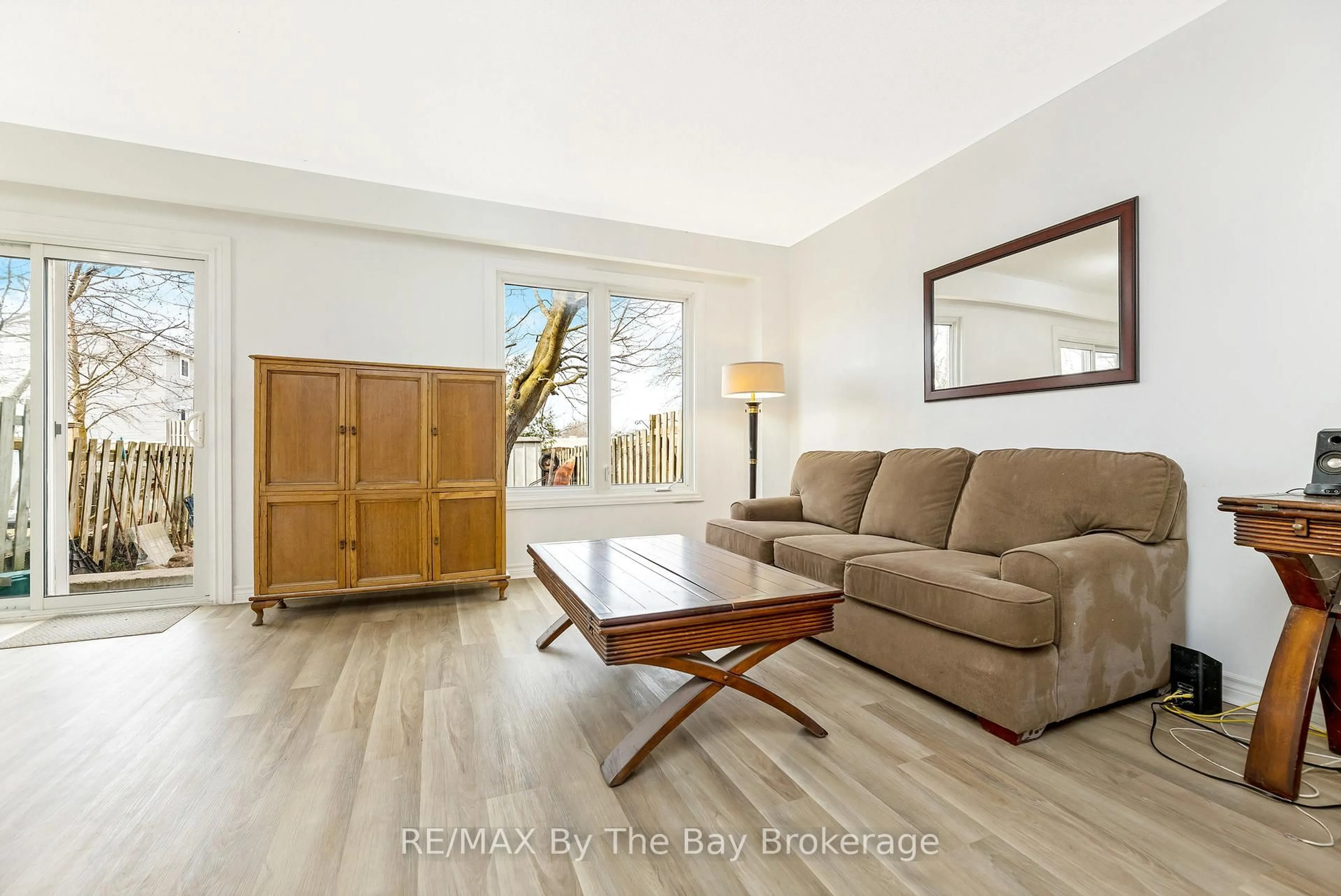 Living room with furniture, wood/laminate floor for 8 Johanna Dr, Orangeville Ontario L9W 3S5