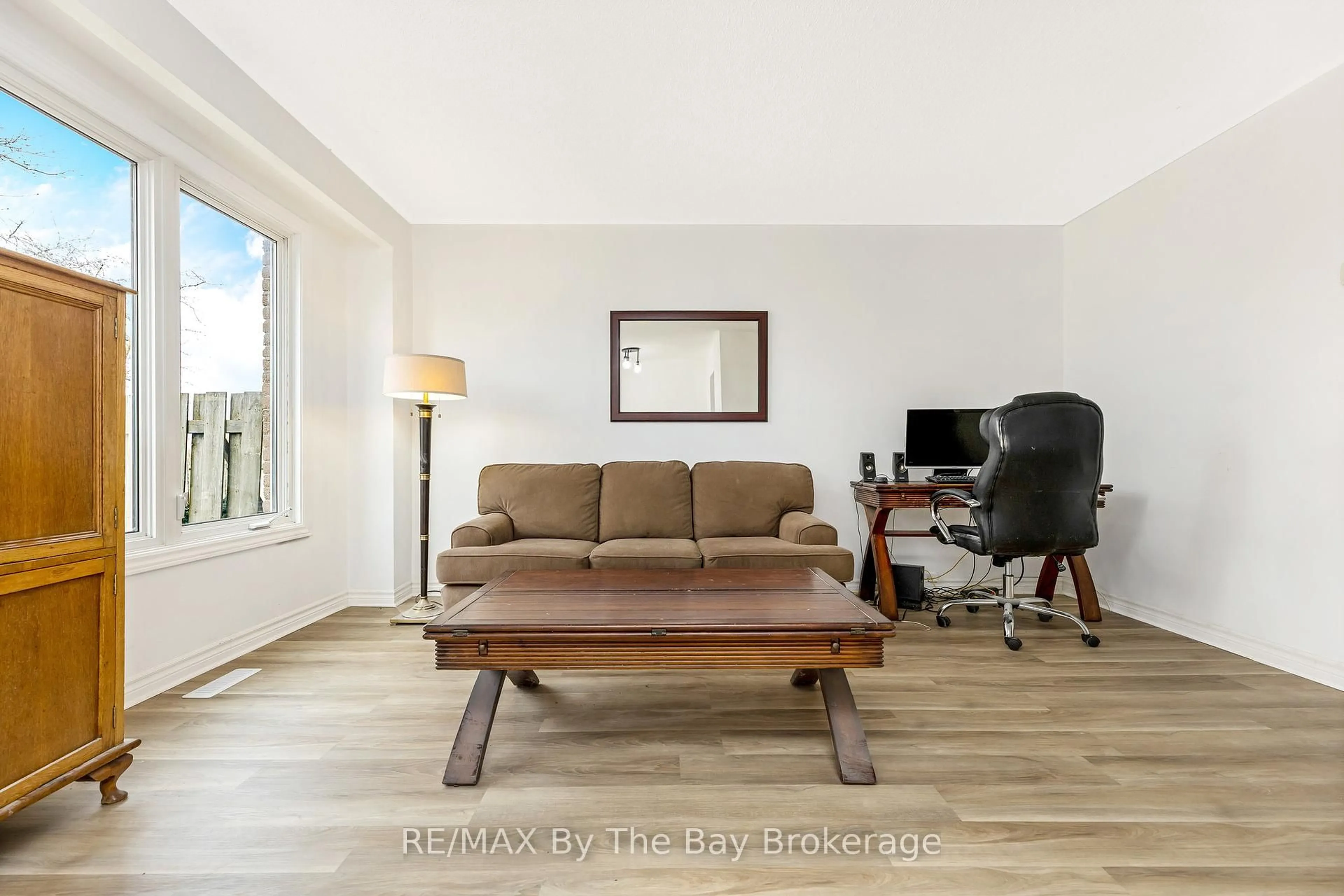 Living room with furniture, wood/laminate floor for 8 Johanna Dr, Orangeville Ontario L9W 3S5