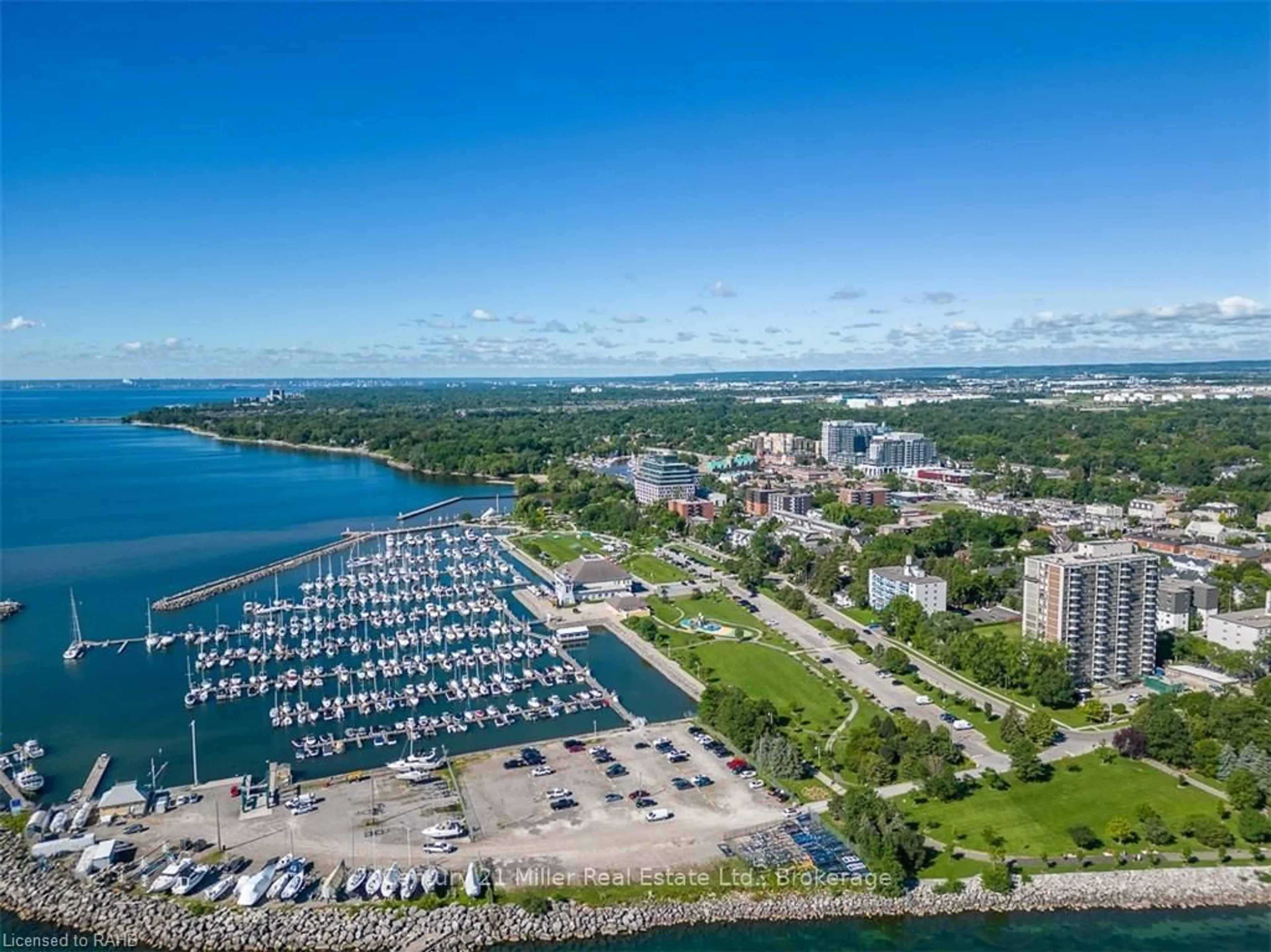 A pic from outside/outdoor area/front of a property/back of a property/a pic from drone, water/lake/river/ocean view for 2185 Marine Dr #203, Oakville Ontario L6L 5L6