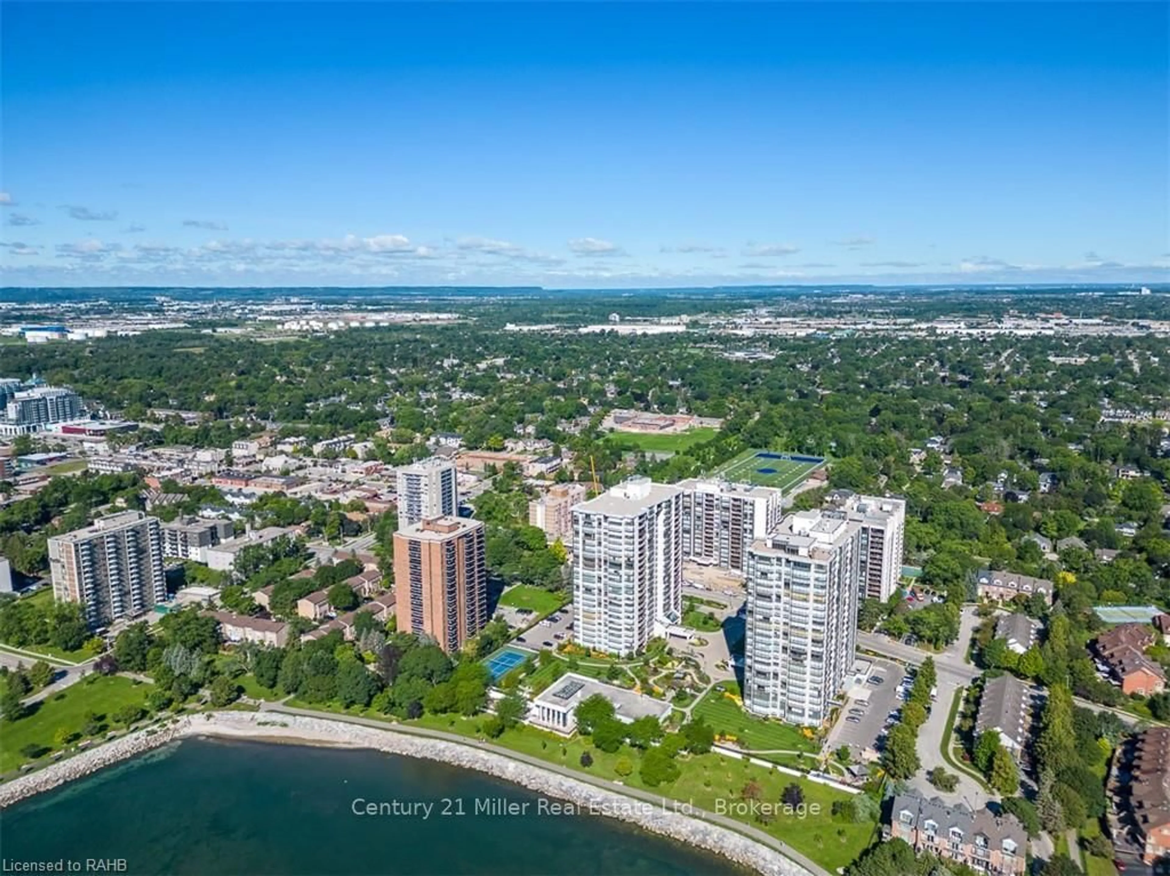 A pic from outside/outdoor area/front of a property/back of a property/a pic from drone, water/lake/river/ocean view for 2185 Marine Dr #203, Oakville Ontario L6L 5L6