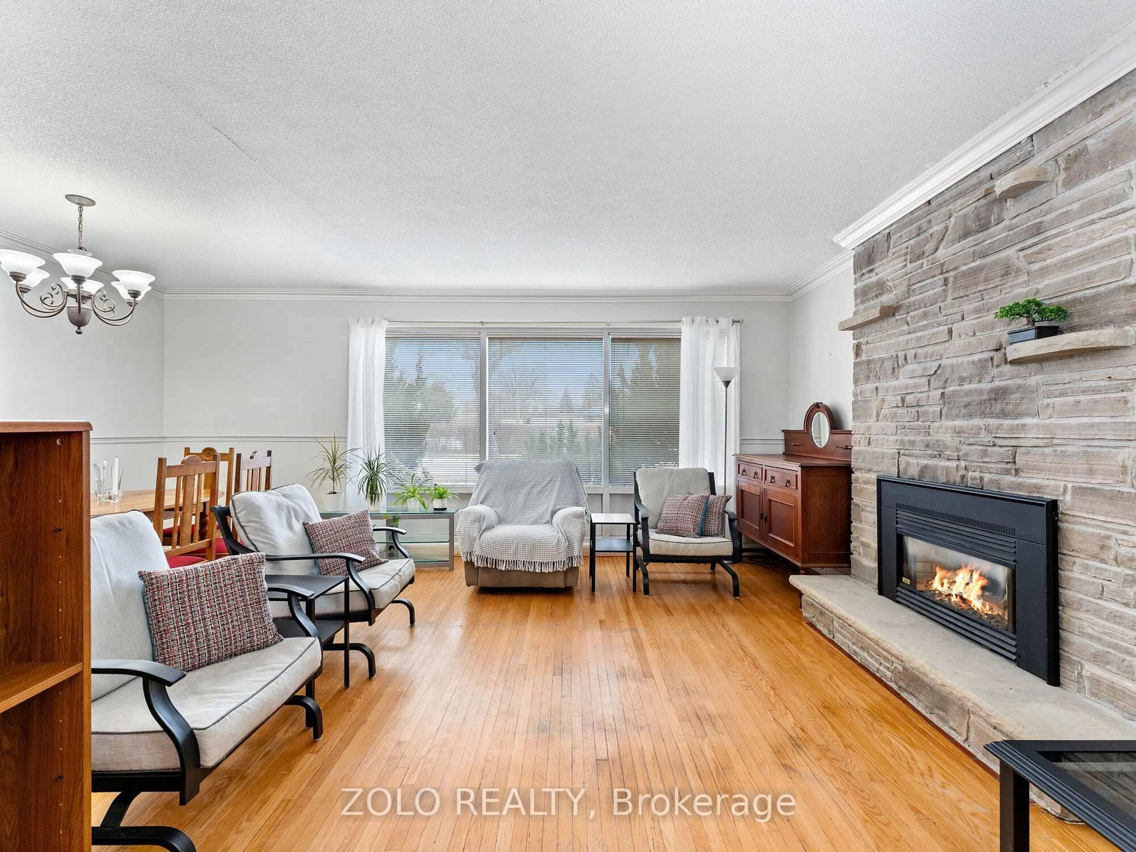 Living room with furniture, wood/laminate floor for 31 Pakenham Dr, Toronto Ontario M9W 4B2