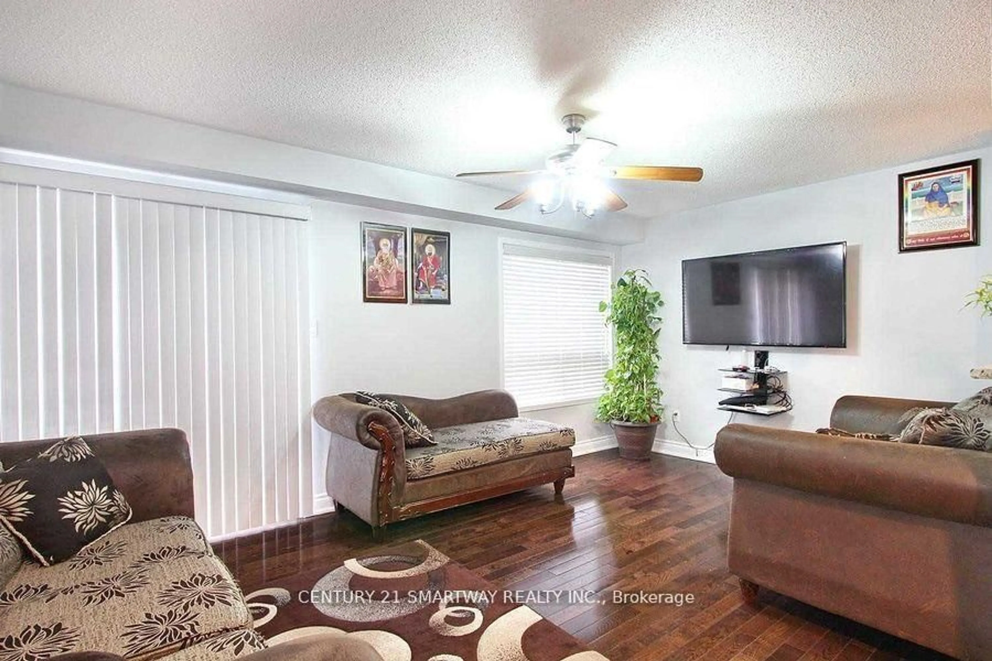 Living room with furniture, wood/laminate floor for 58 Feather Reed Way, Brampton Ontario L6R 2Z9