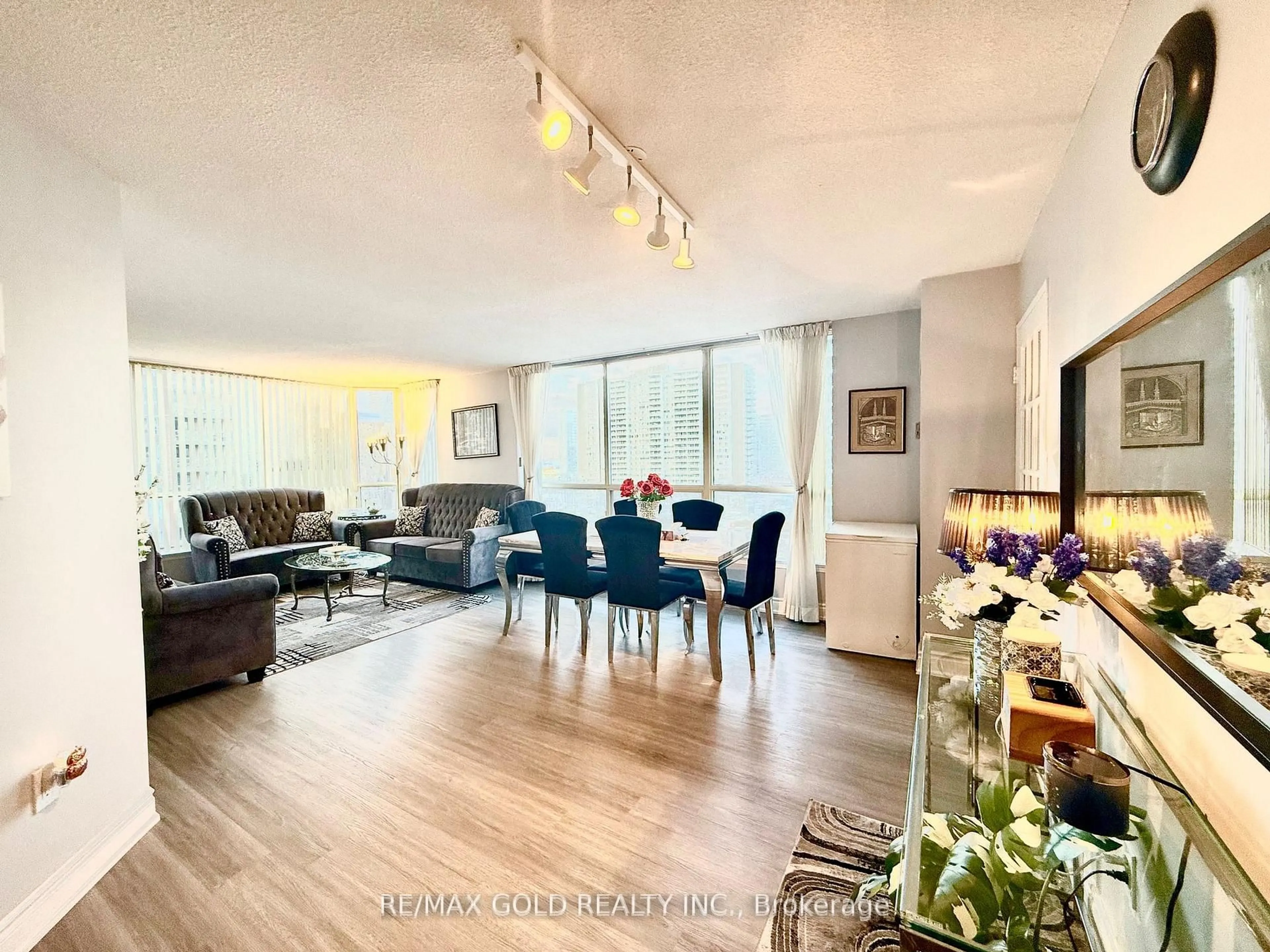 Living room with furniture, wood/laminate floor for 55 Elm Dr #805, Mississauga Ontario L5B 3Z3