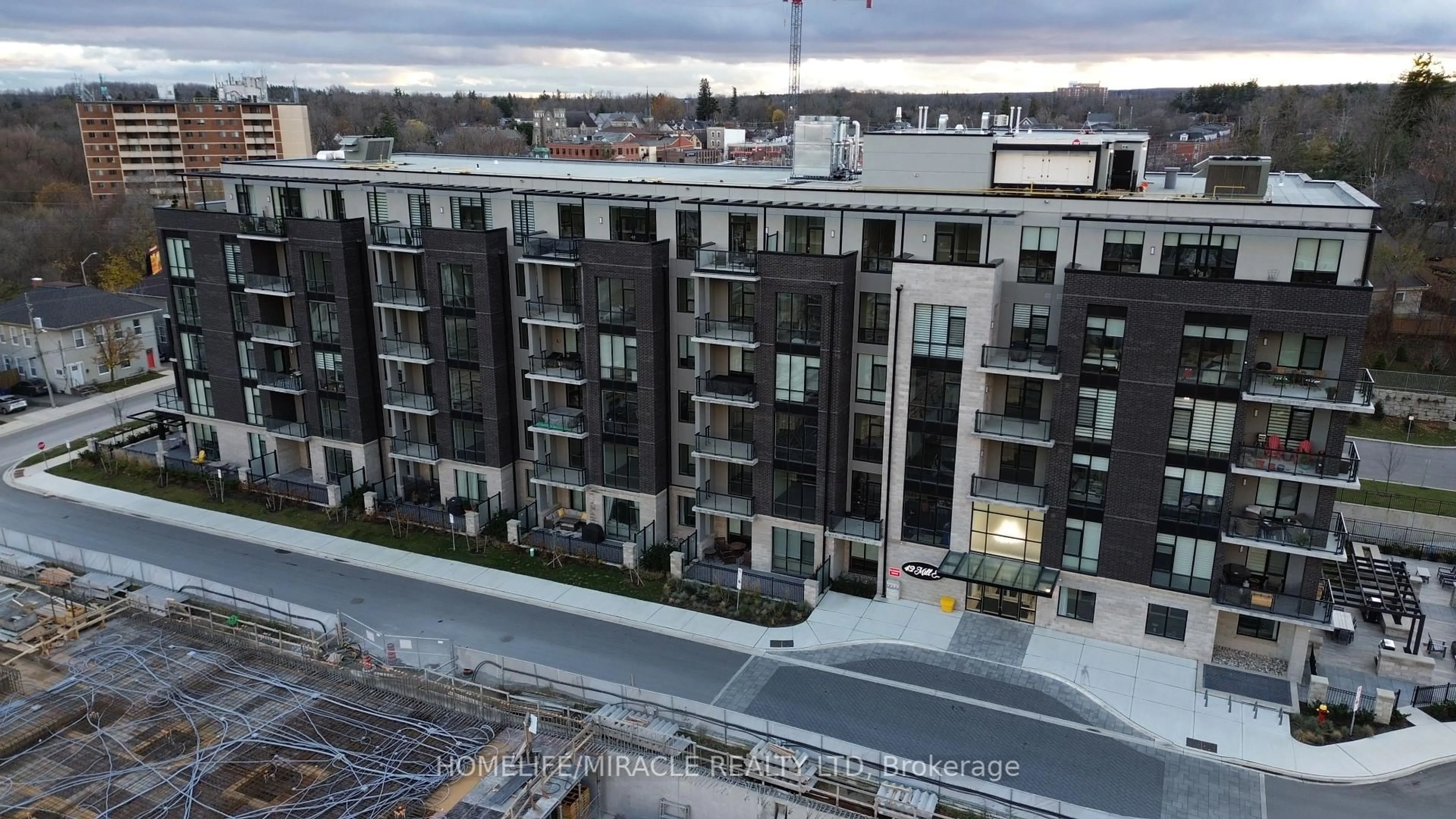 A pic from outside/outdoor area/front of a property/back of a property/a pic from drone, city buildings view from balcony for 42 Mill St #414, Halton Hills Ontario L7G 0P9