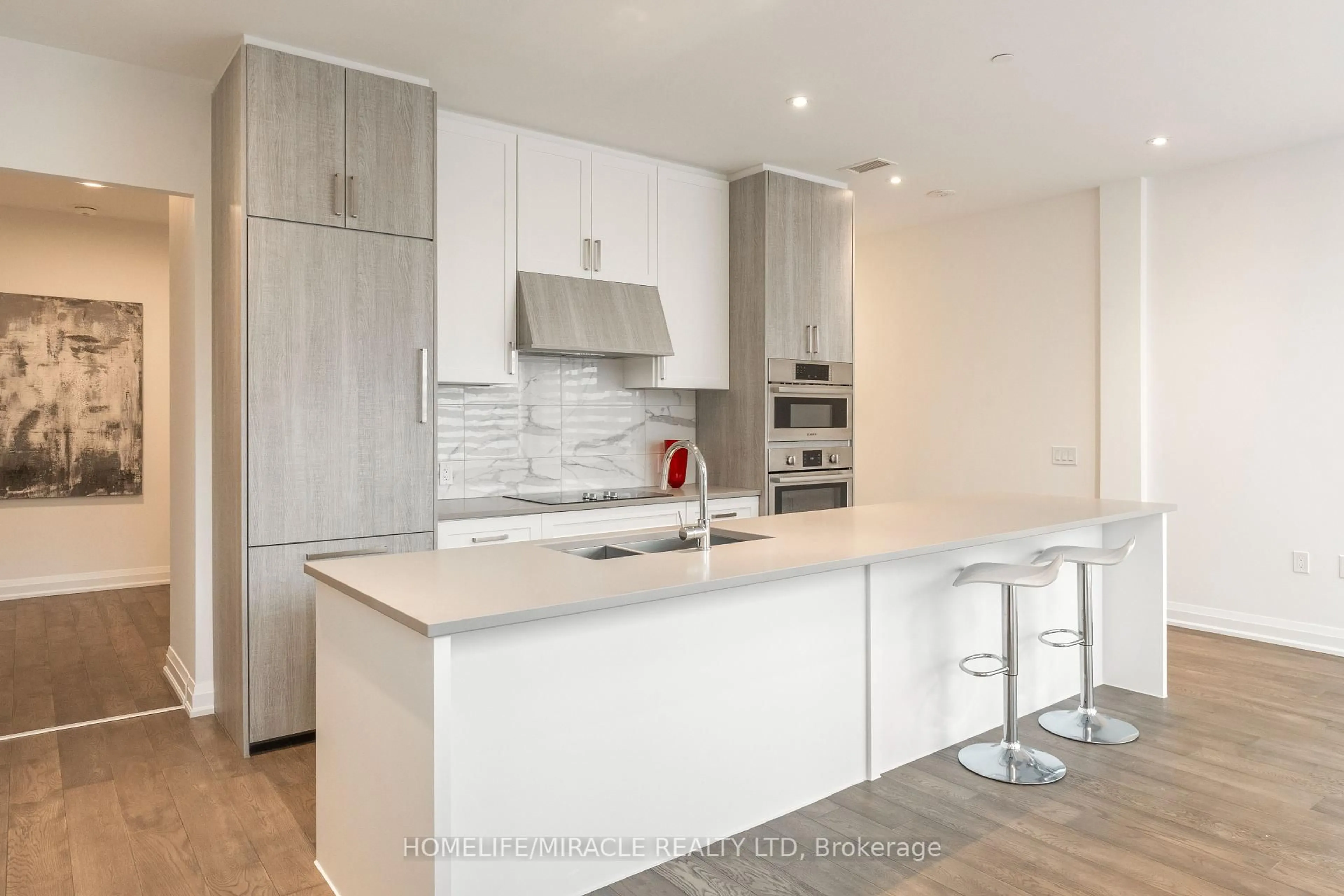 Open concept kitchen, wood/laminate floor for 42 Mill St #414, Halton Hills Ontario L7G 0P9