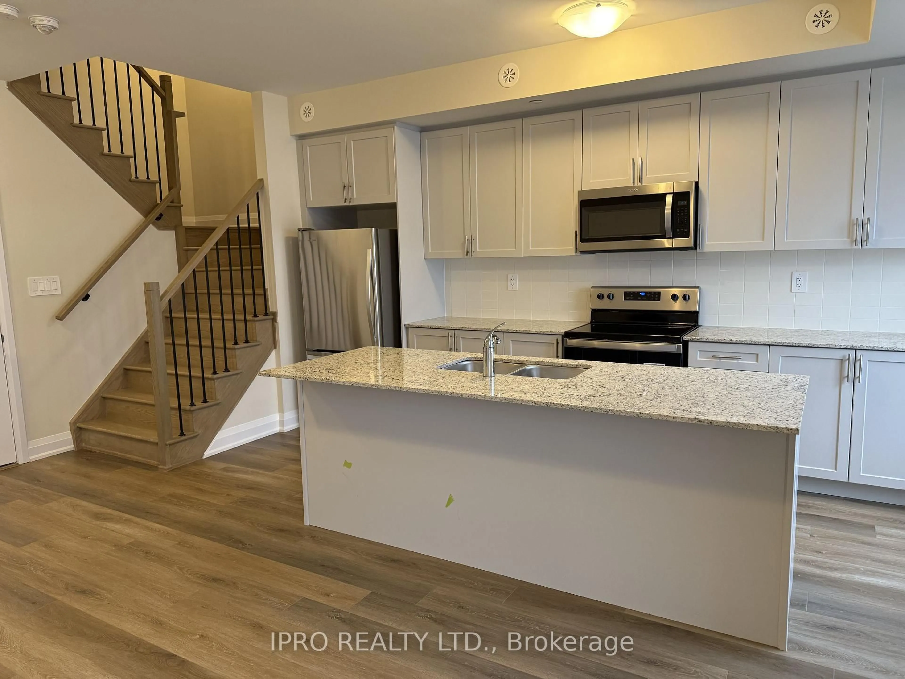 Open concept kitchen, unknown for 1581 Rose Way #115, Milton Ontario L9E 1N4