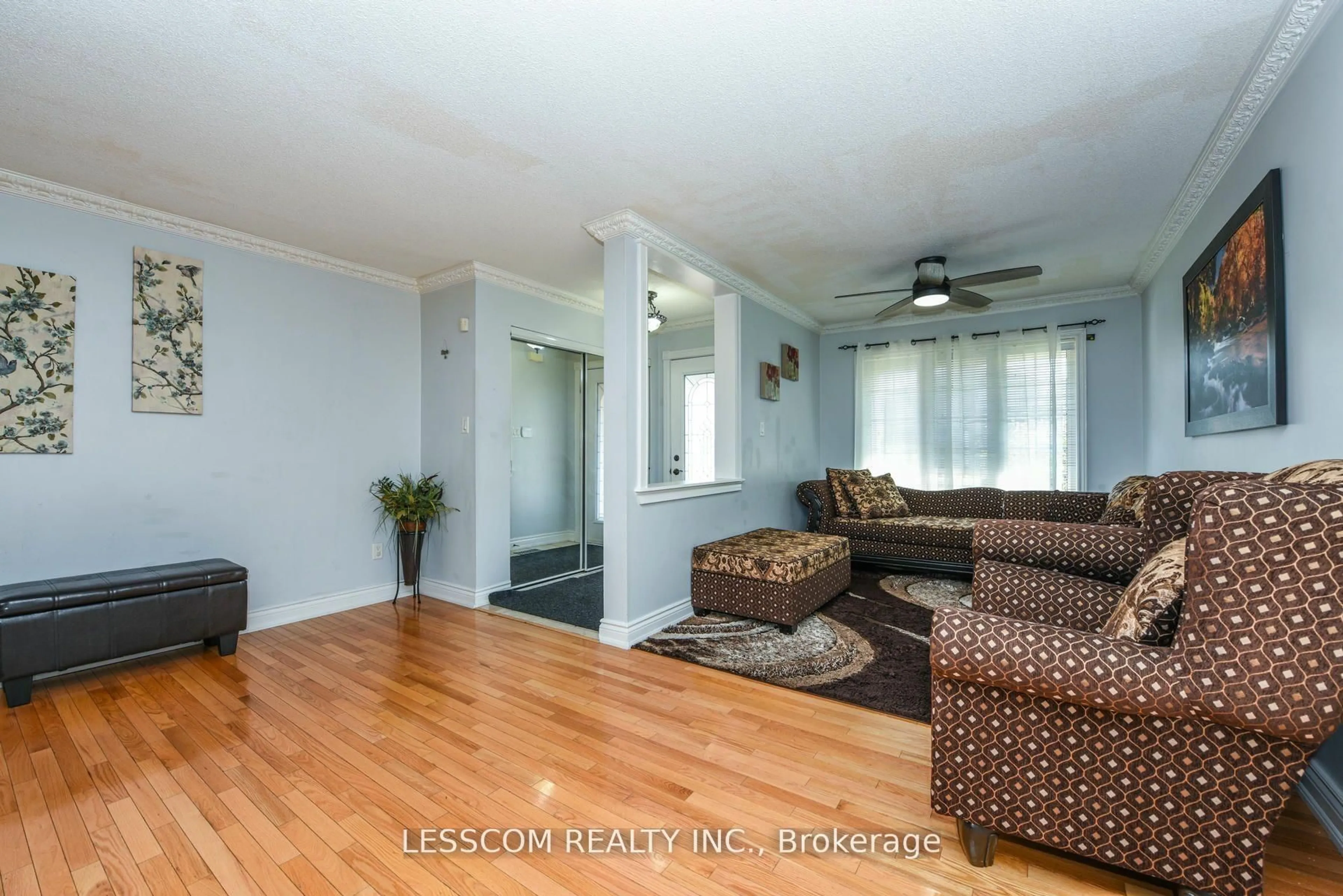 Living room with furniture, wood/laminate floor for 30 Fairhill Ave, Brampton Ontario L7A 2E7