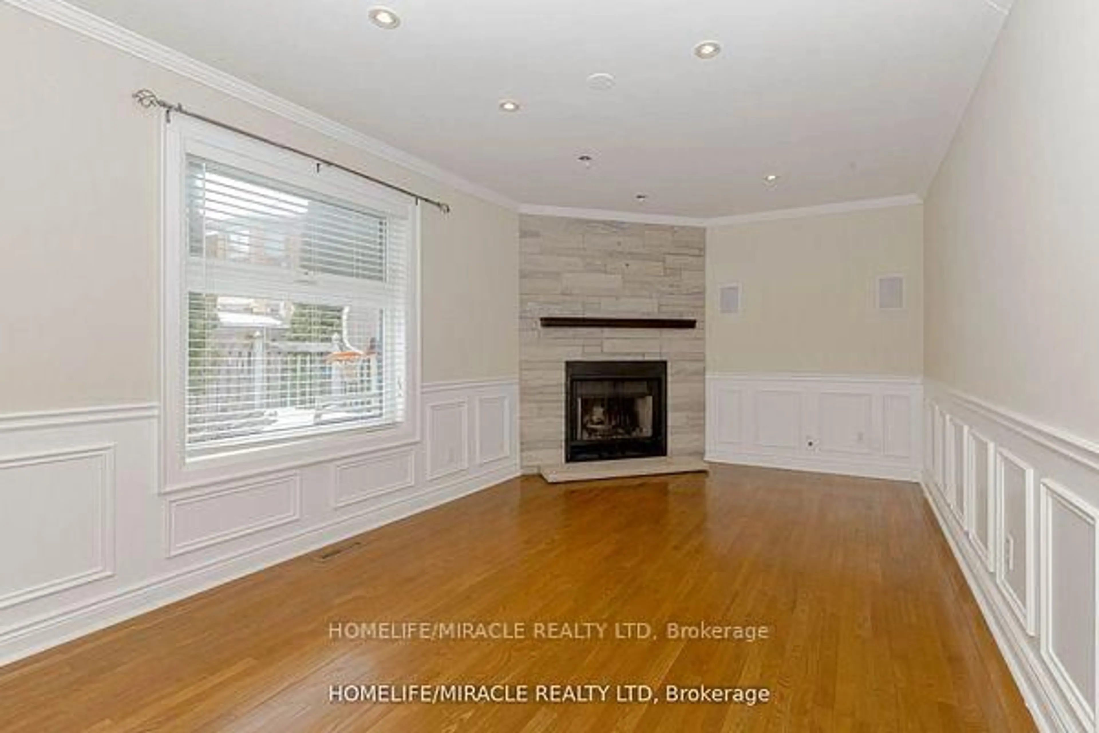 Living room with furniture, wood/laminate floor for 5393 Fallingbrook Dr, Mississauga Ontario L5V 1P7