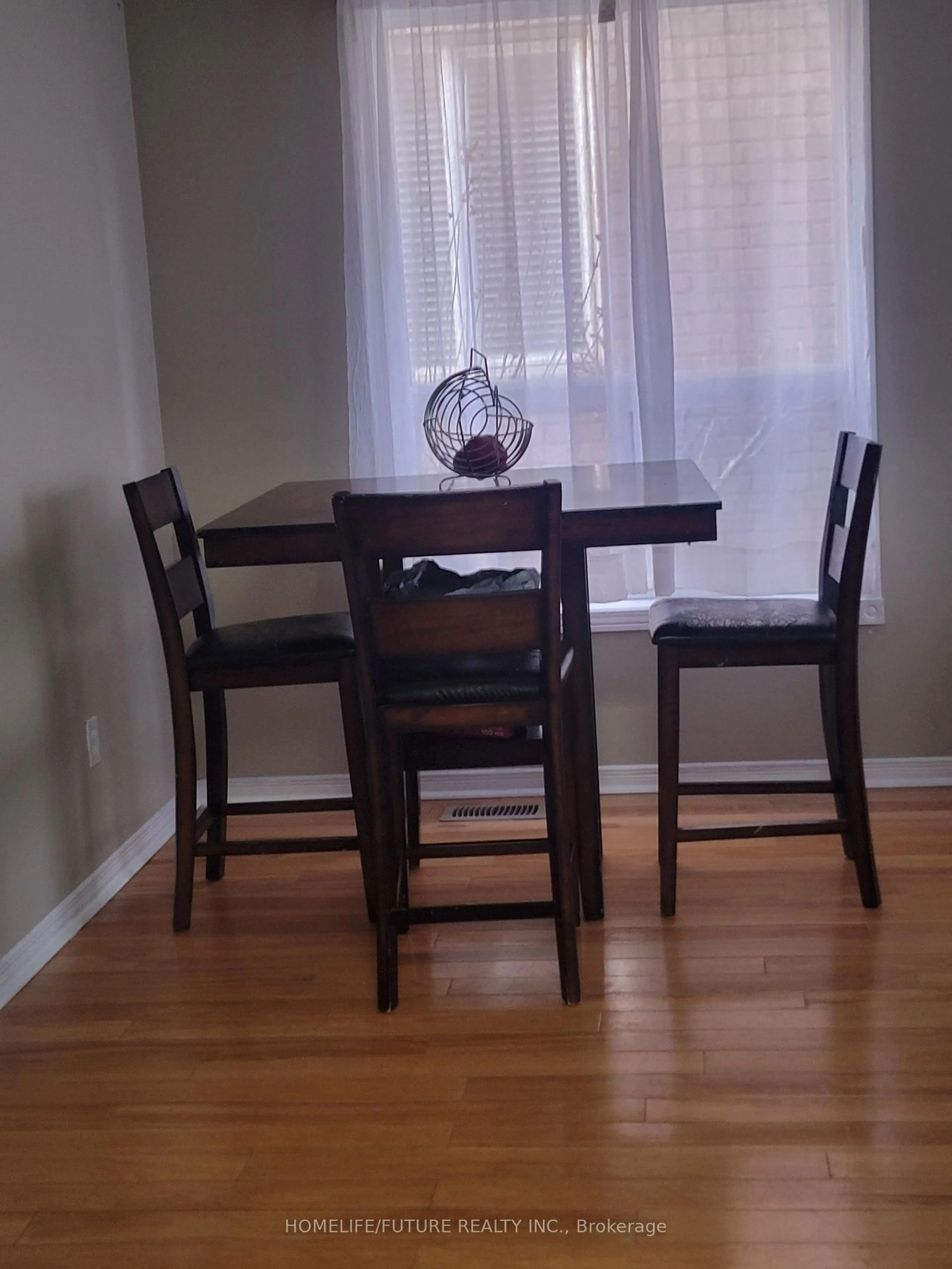 Dining room, wood/laminate floor for 14 Peachleaf Cres, Brampton Ontario L7A 2B2