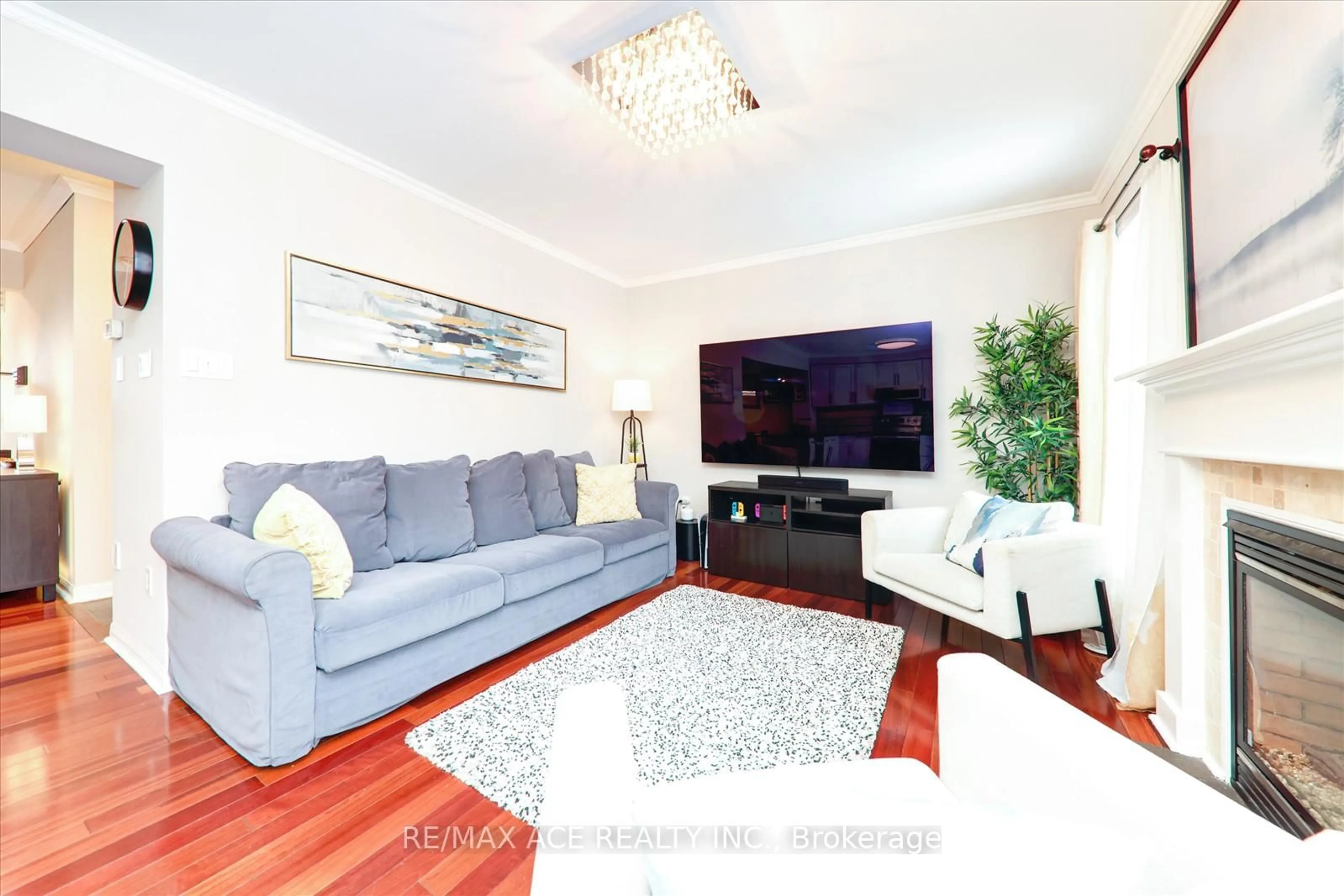 Living room with furniture, wood/laminate floor for 813 Scott Blvd, Milton Ontario L9T 2C9