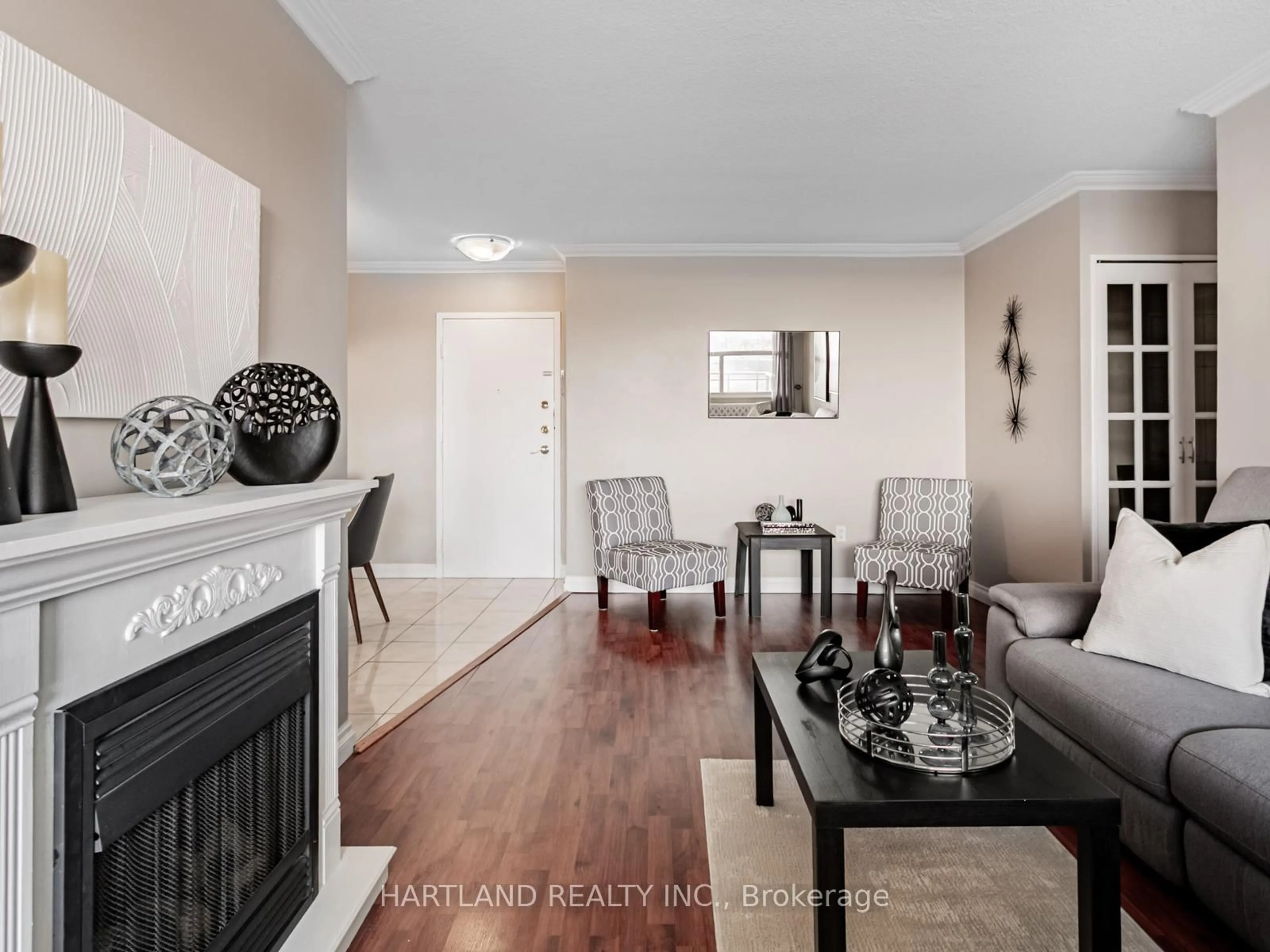 Living room with furniture, wood/laminate floor for 966 Inverhouse Dr #701, Mississauga Ontario L5J 4B6