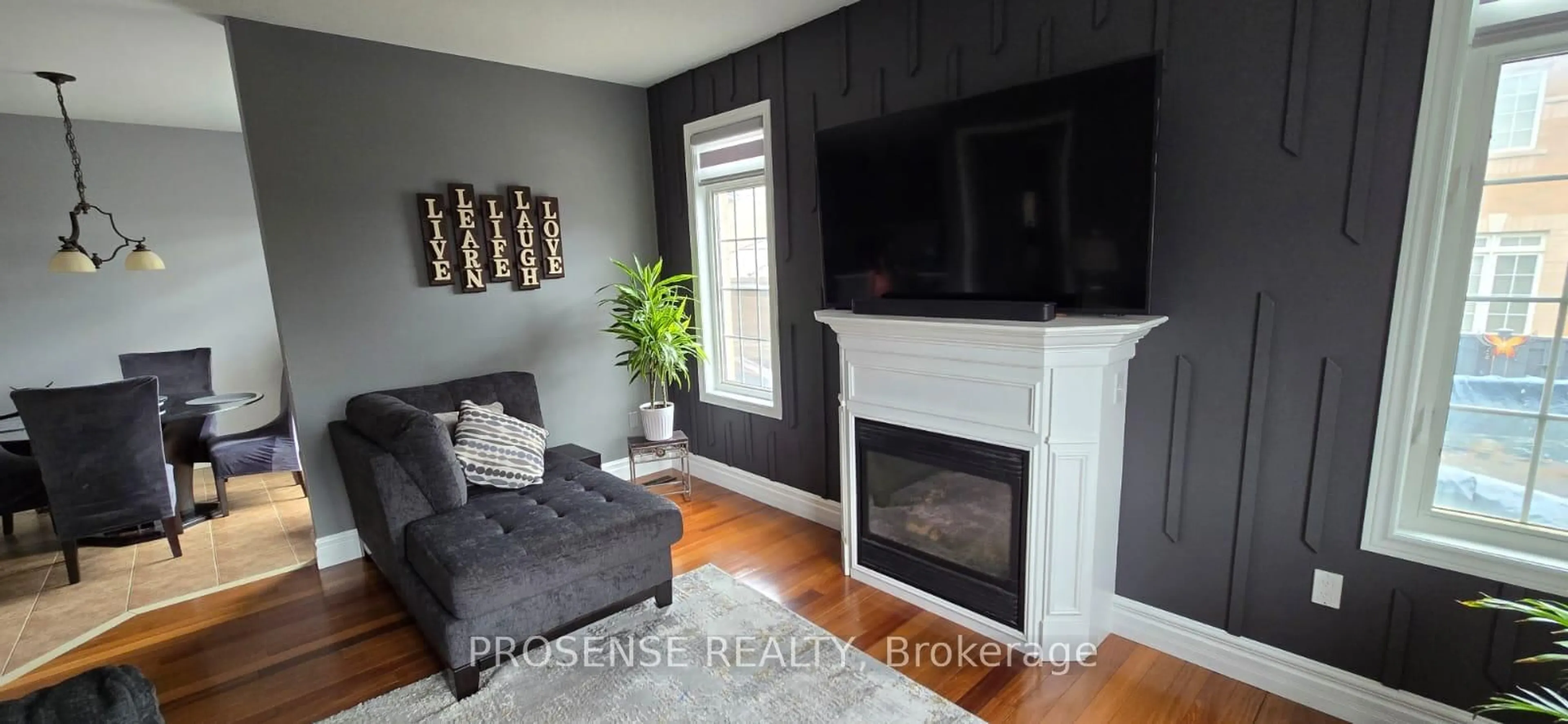 Living room with furniture, wood/laminate floor for 29 Ashby Field Rd, Brampton Ontario L6X 0R4