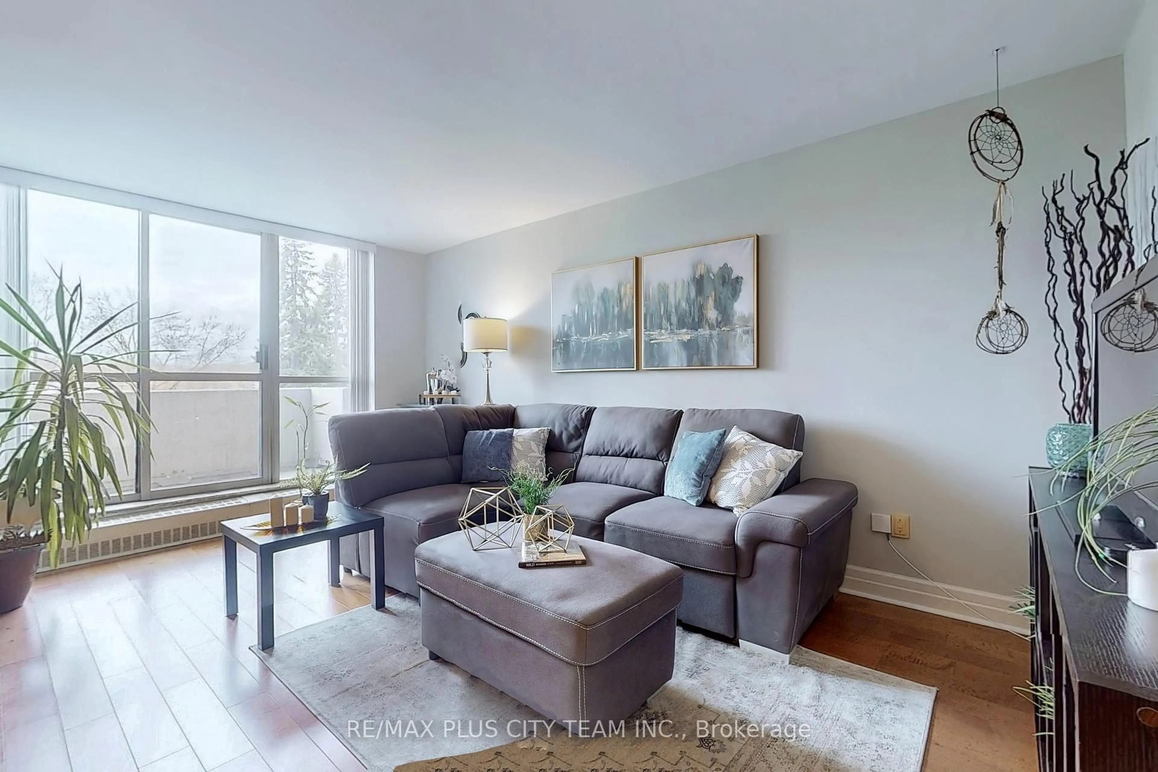 Living room with furniture, wood/laminate floor for 35 Ormskirk Ave #215, Toronto Ontario M6S 1A8