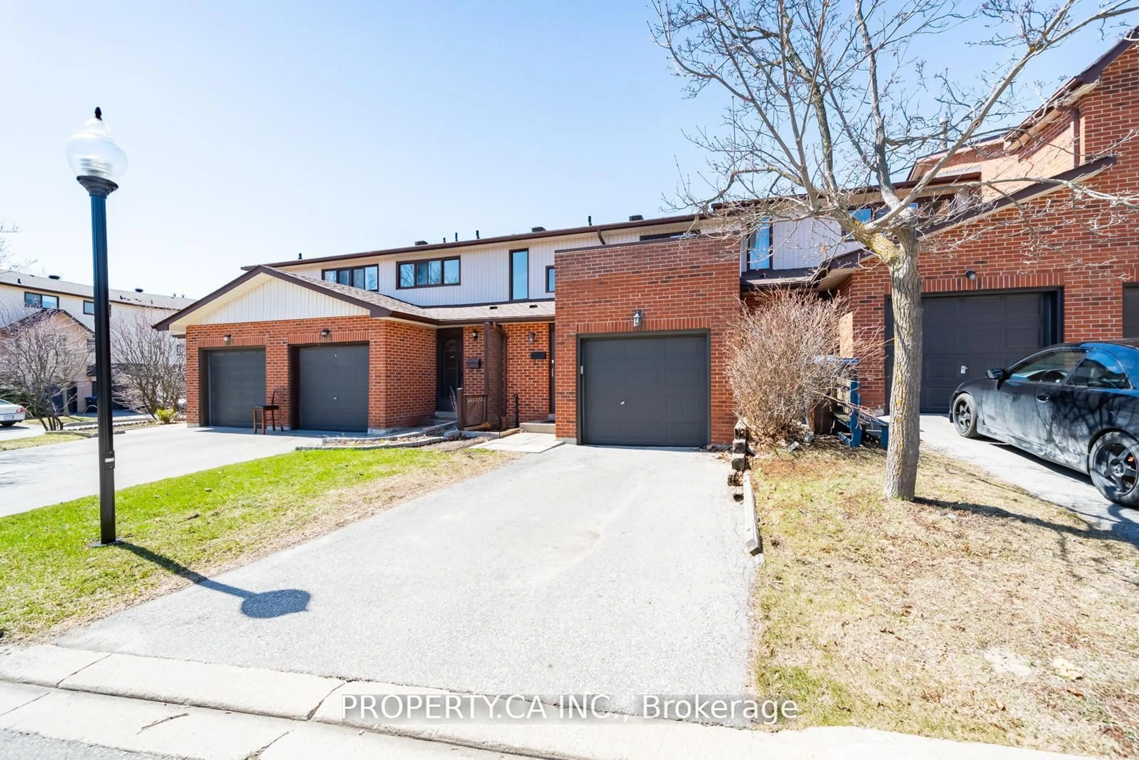 Home with brick exterior material, street for 64 Dawson Cres, Brampton Ontario L6V 3M6