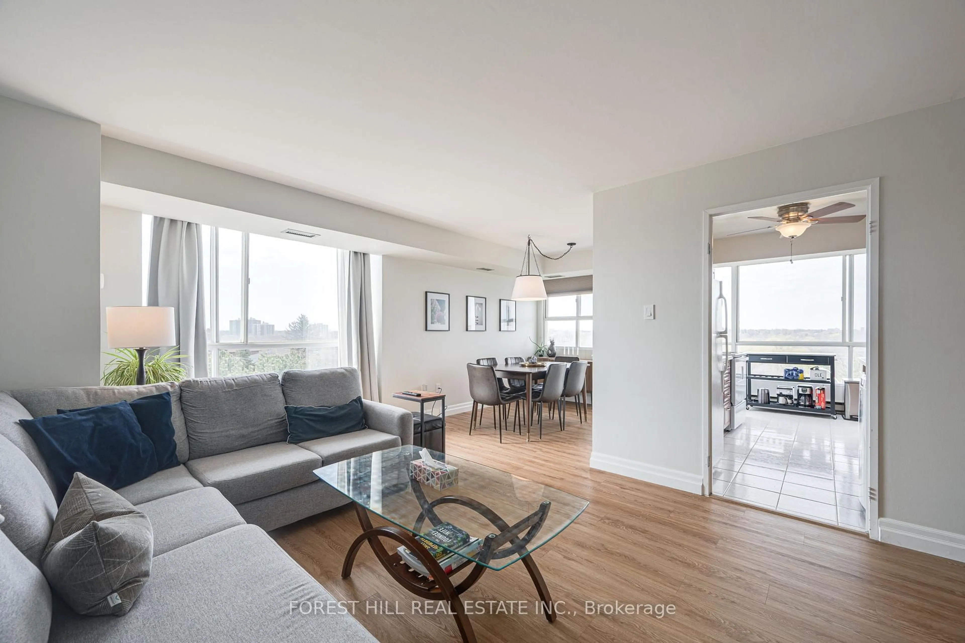 Living room with furniture, wood/laminate floor for 3077 Weston Rd #609, Toronto Ontario M9M 3A1