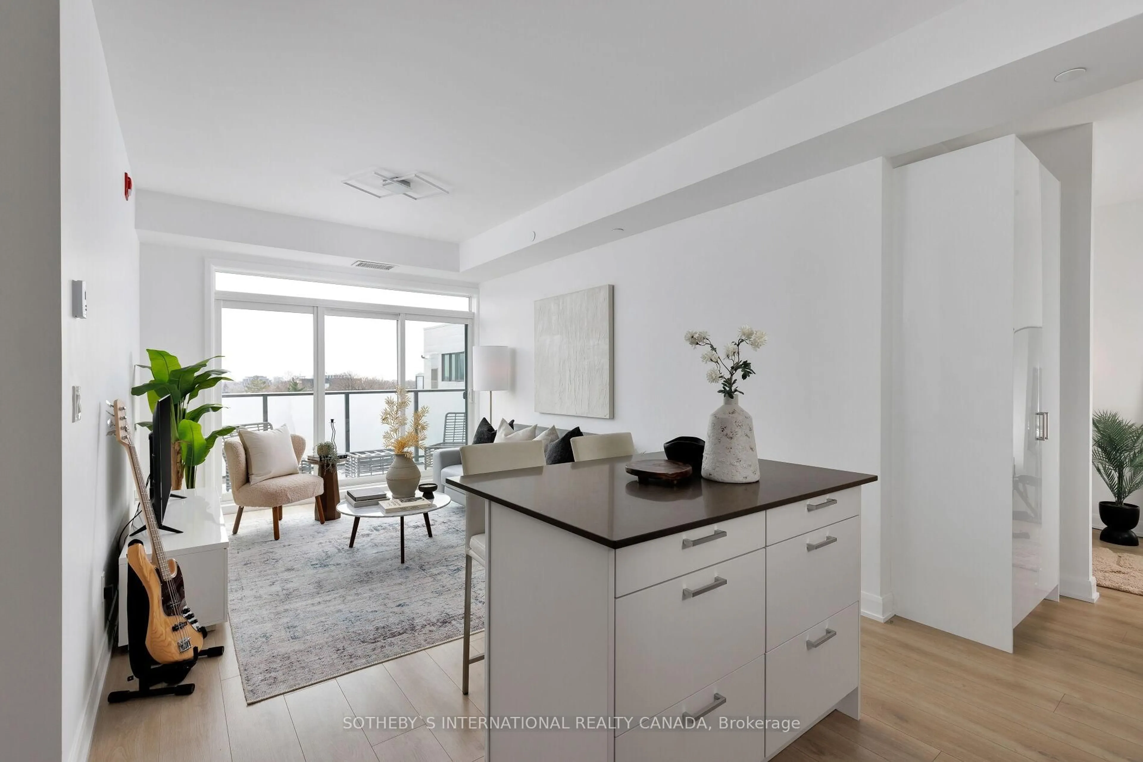 Open concept kitchen, wood/laminate floor for 385 Osler St #610, Toronto Ontario M6N 0B2