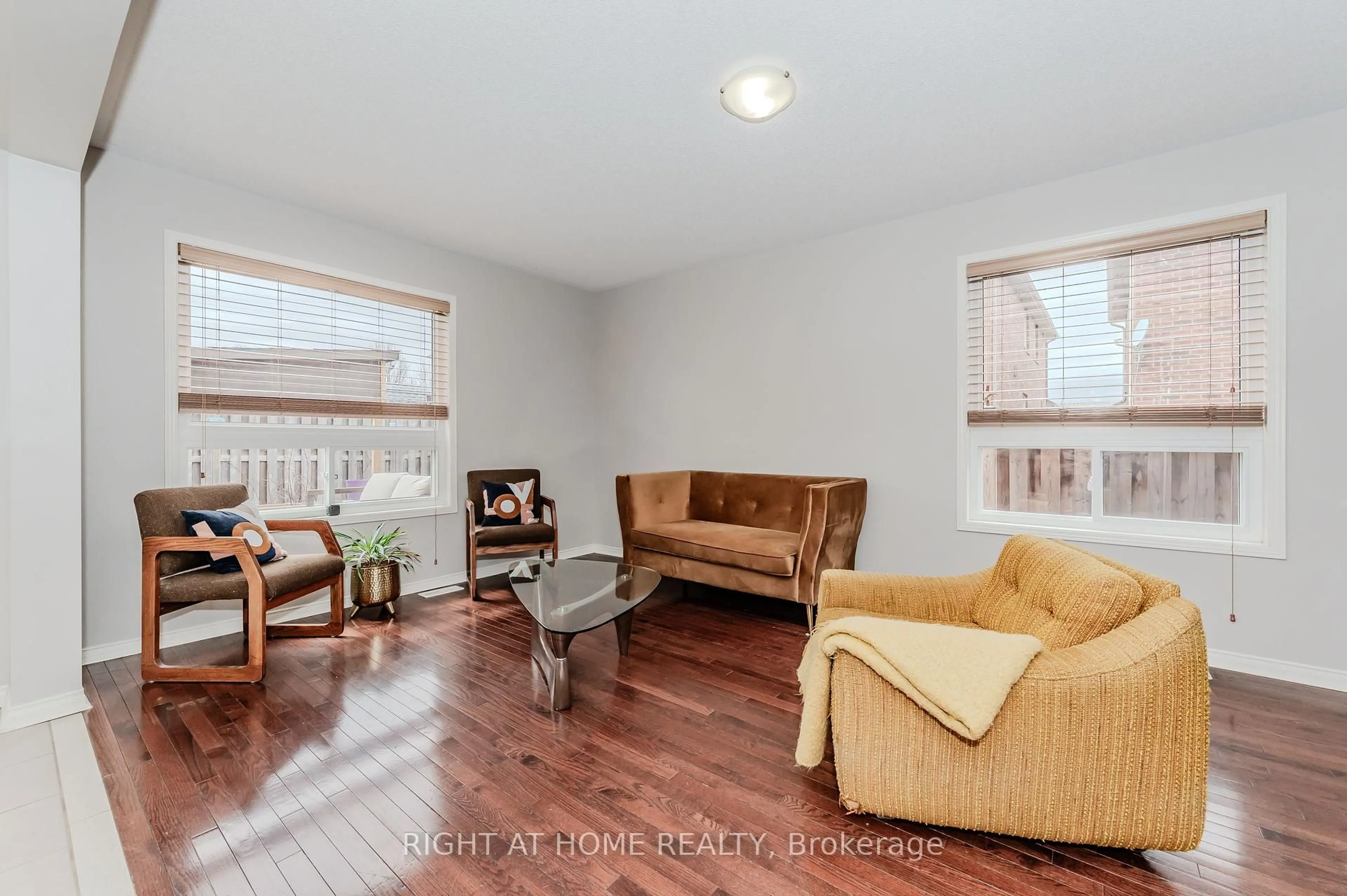 Living room with furniture, wood/laminate floor for 22 Albery Rd, Brampton Ontario L7A 0K7
