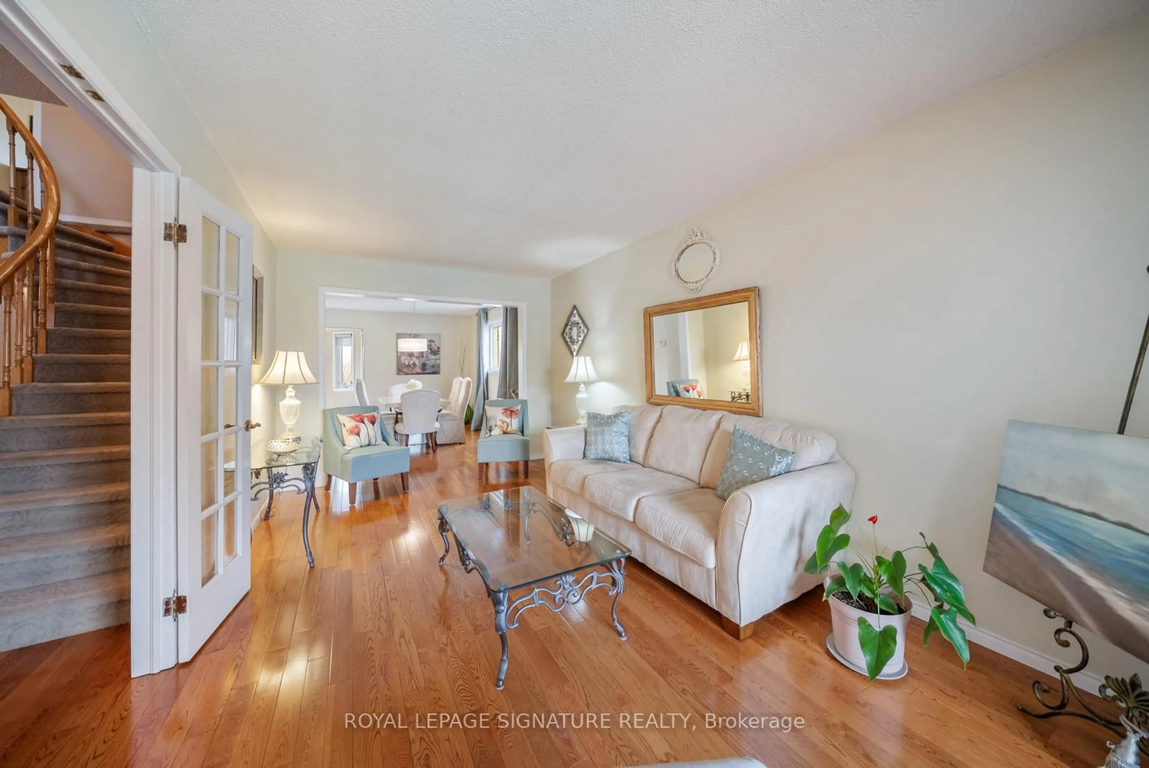 Living room with furniture, wood/laminate floor for 1378 Sweetbirch Crt, Mississauga Ontario L5C 3R3