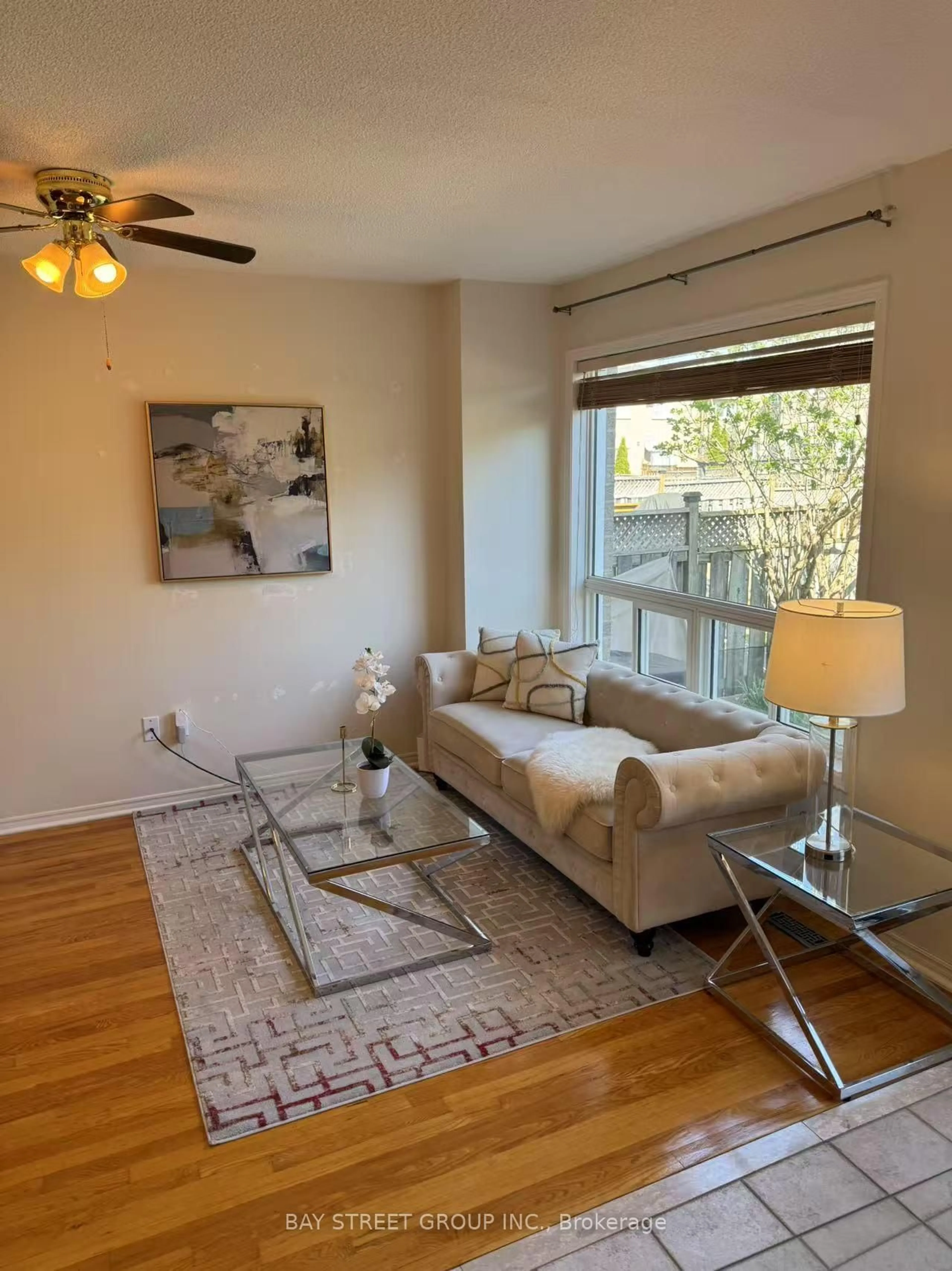 Living room with furniture, wood/laminate floor for 3740 Windhaven Dr, Mississauga Ontario L5N 7V5