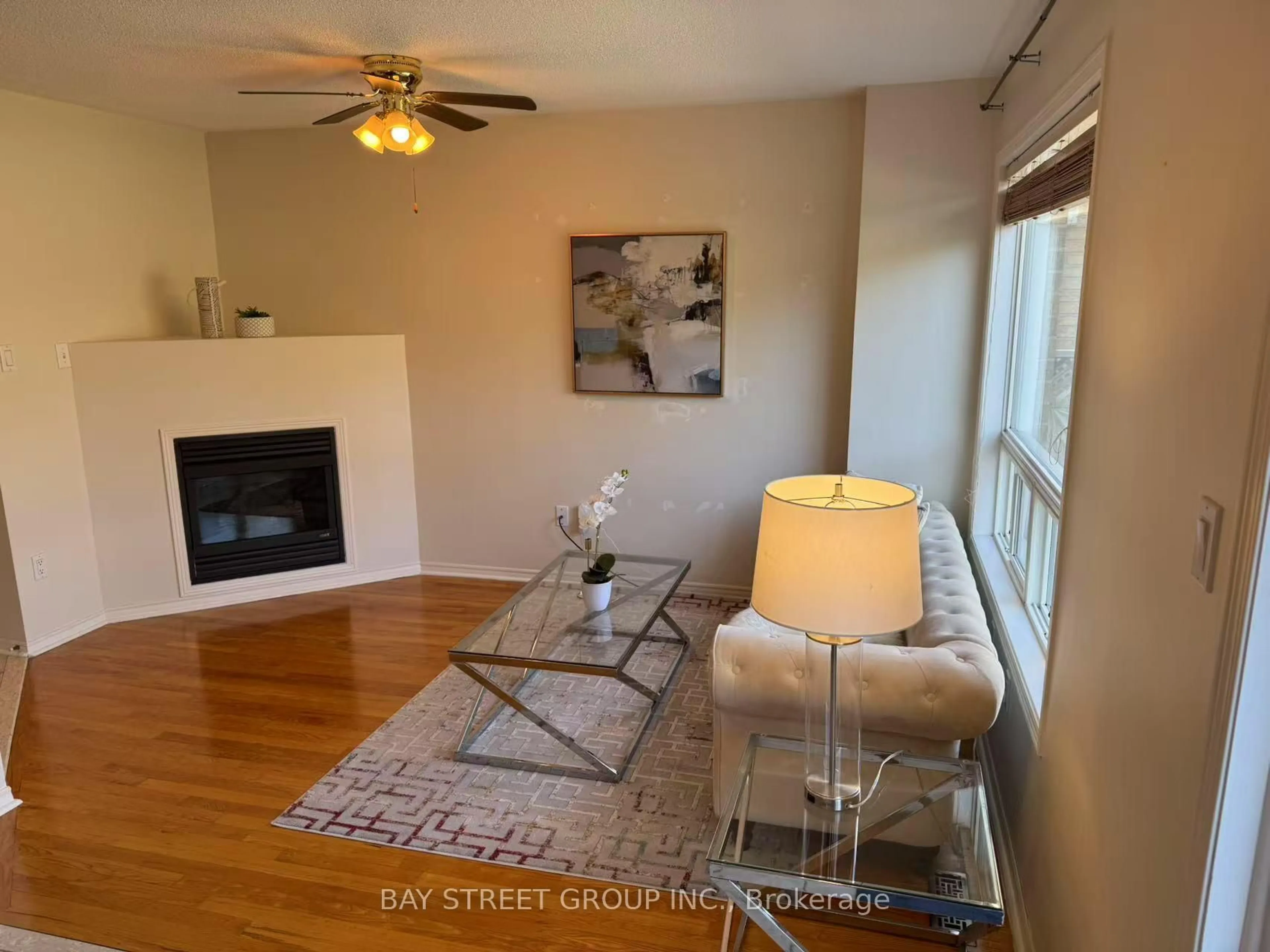 Living room with furniture, wood/laminate floor for 3740 Windhaven Dr, Mississauga Ontario L5N 7V5