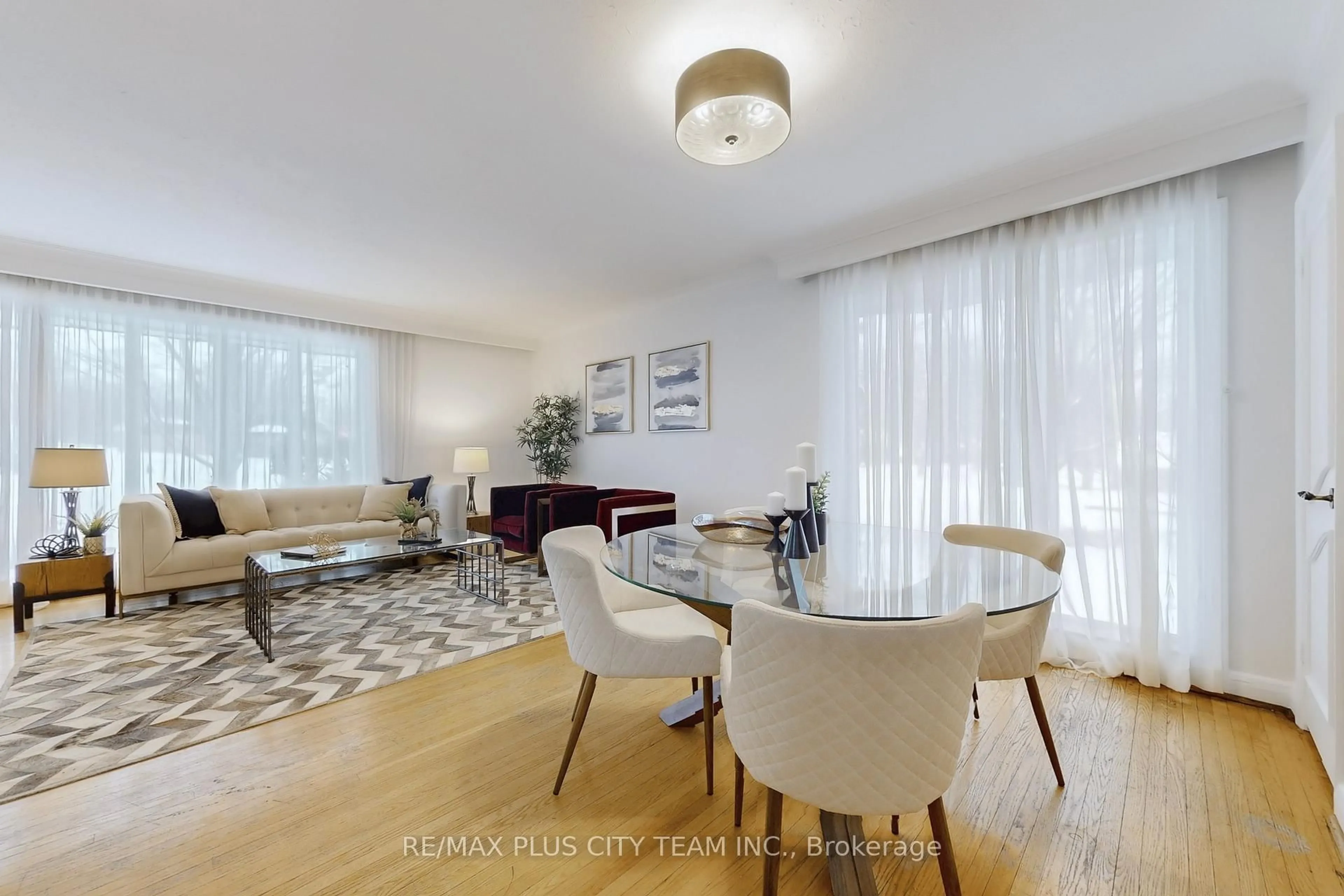 Living room with furniture, wood/laminate floor for 17 Hedges Blvd, Toronto Ontario M9B 3C3
