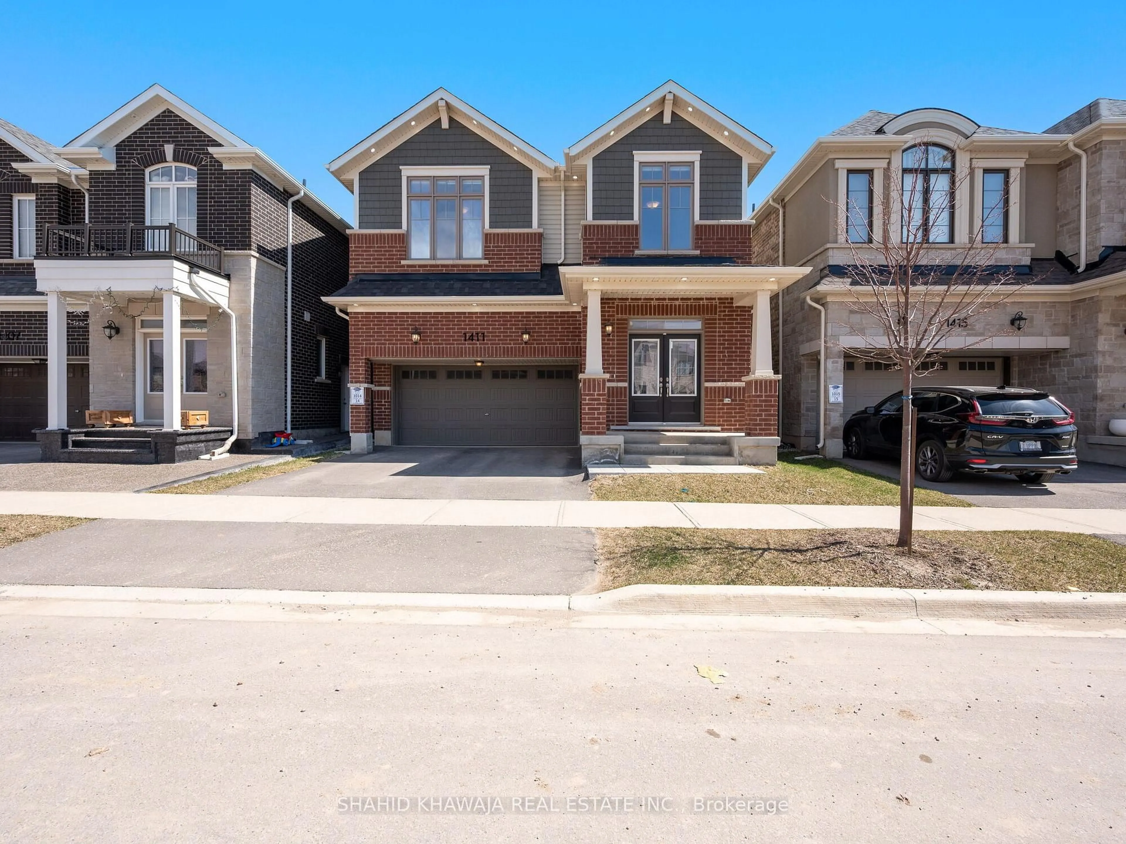 Home with brick exterior material, street for 1411 Buckthorn Gdns, Milton Ontario L9E 1P9