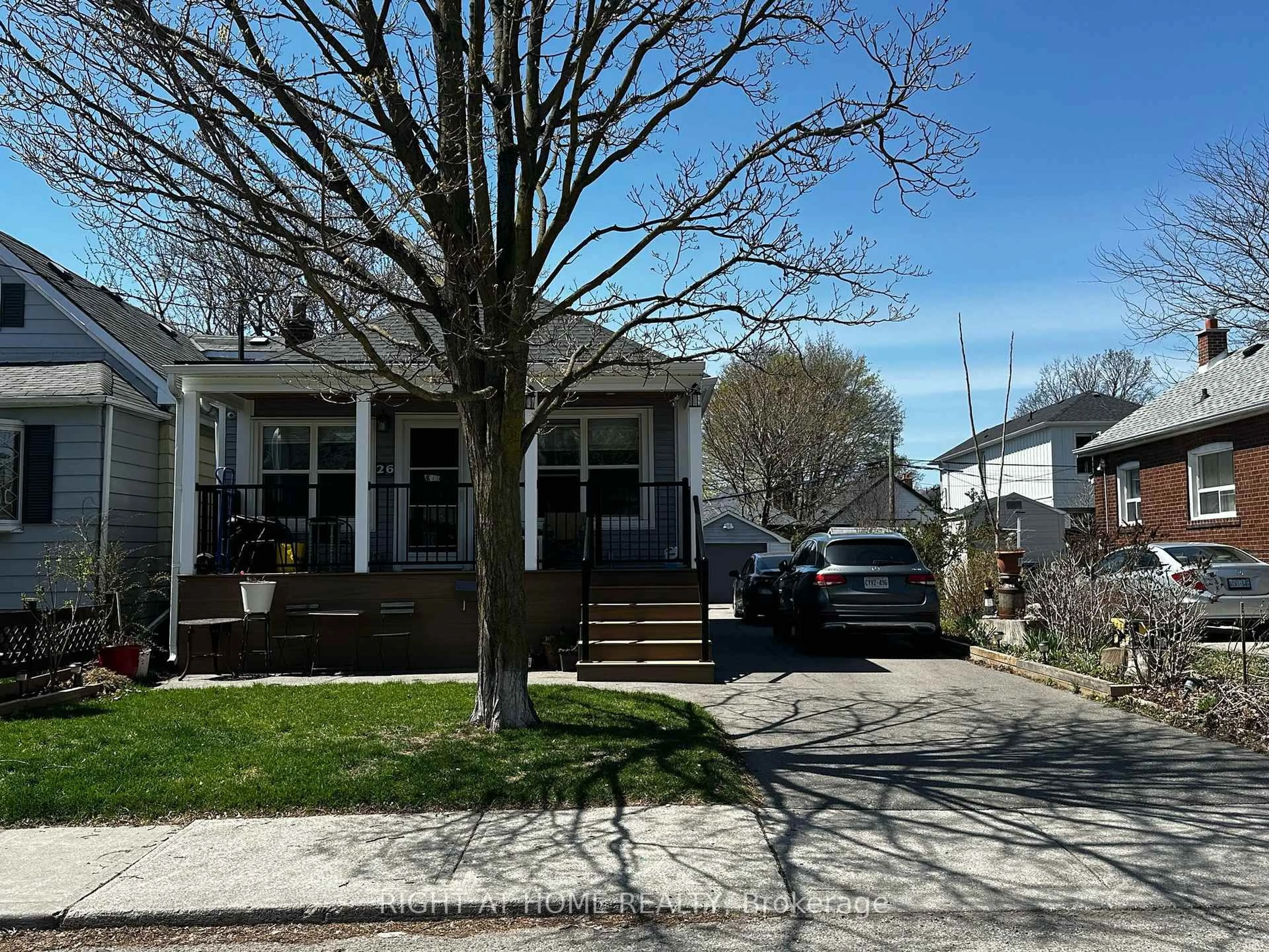 Home with vinyl exterior material, street for 26 Sixteenth St, Toronto Ontario M8V 3J8