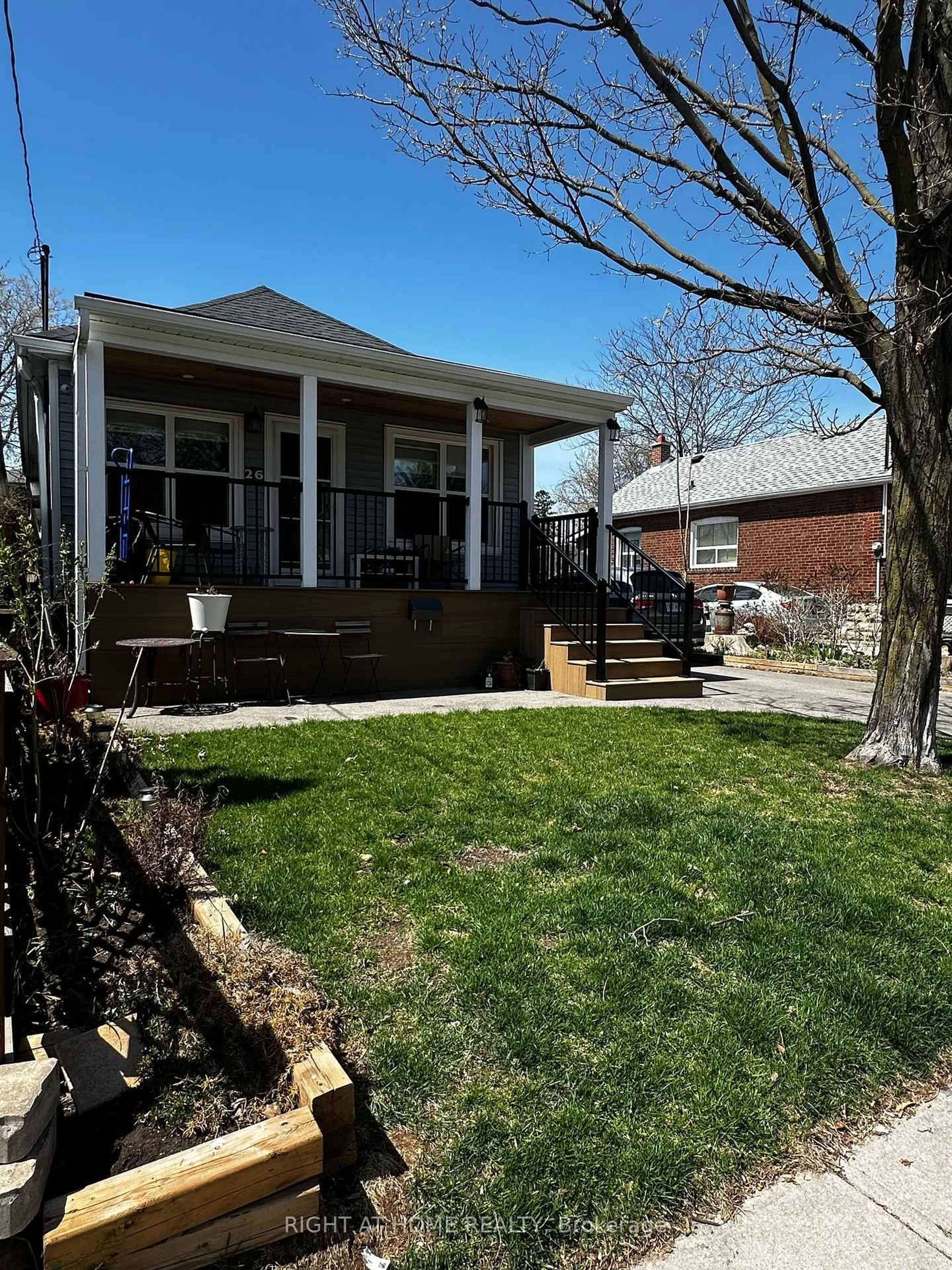 Home with vinyl exterior material, street for 26 Sixteenth St, Toronto Ontario M8V 3J8