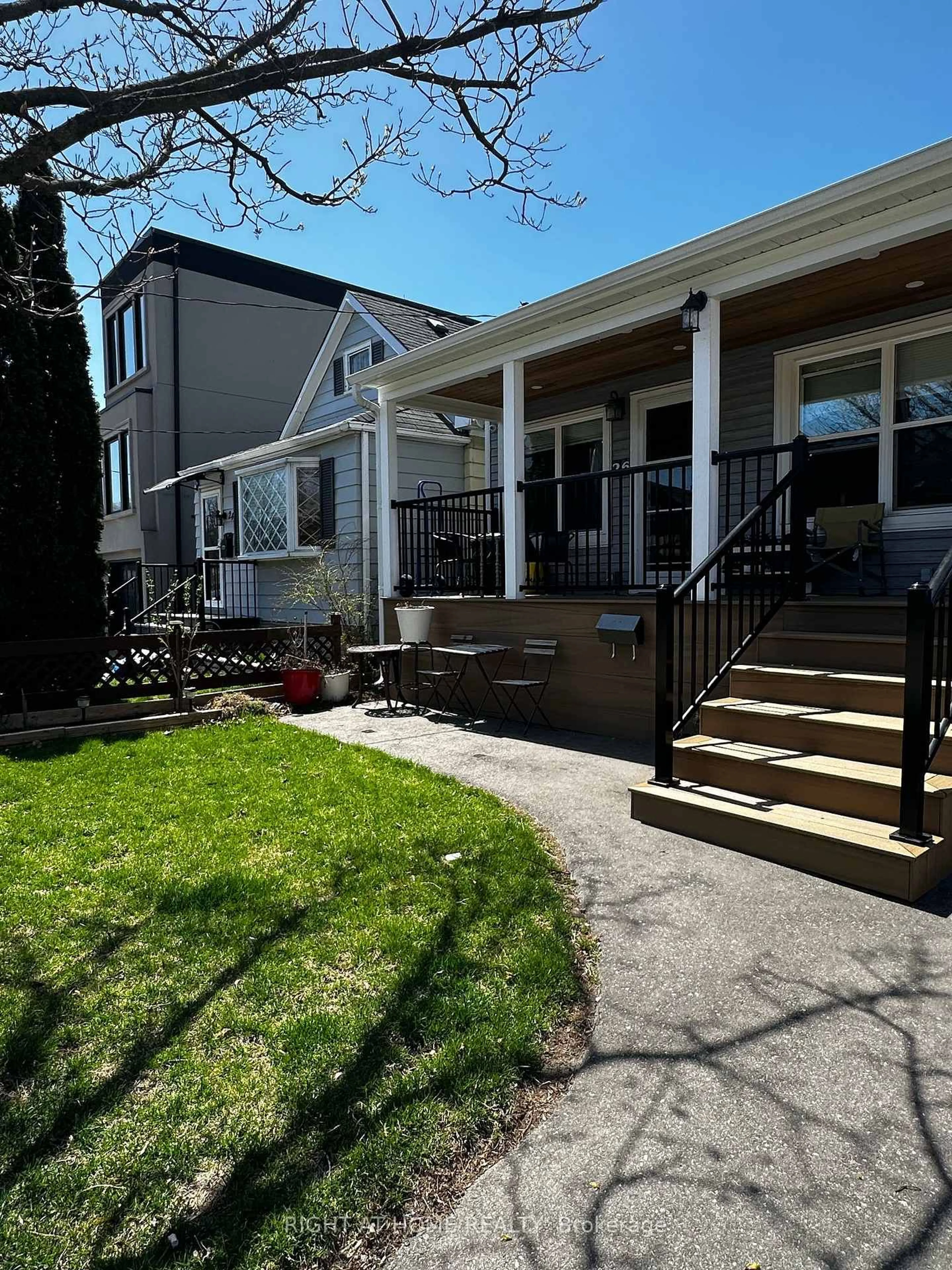 Home with vinyl exterior material, street for 26 Sixteenth St, Toronto Ontario M8V 3J8