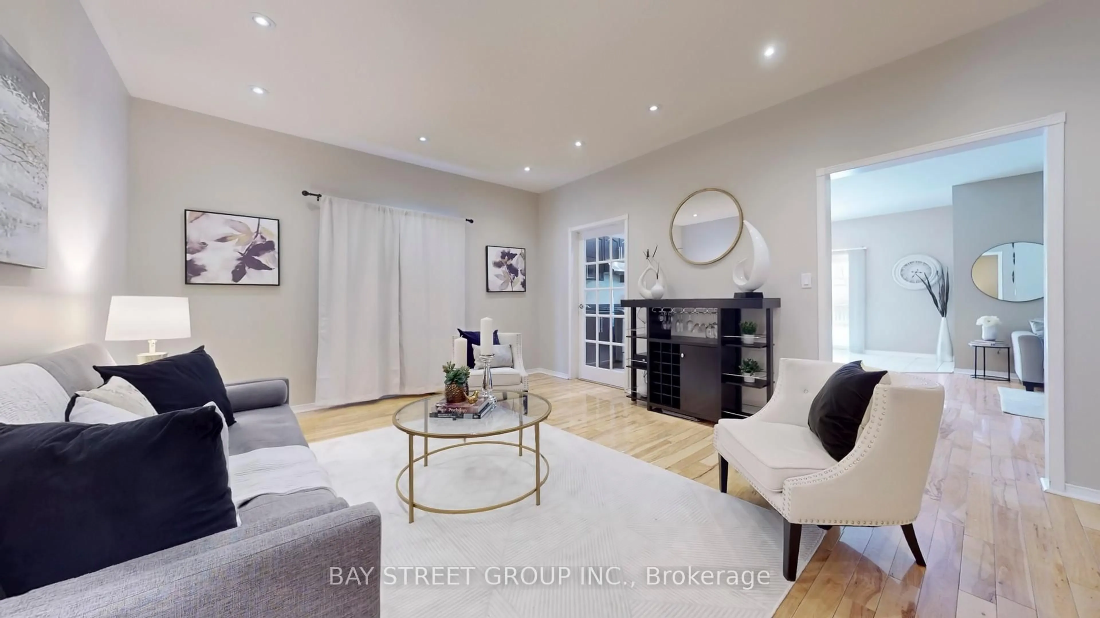 Living room with furniture, wood/laminate floor for 7229 Dime Cres, Mississauga Ontario L5W 1K5