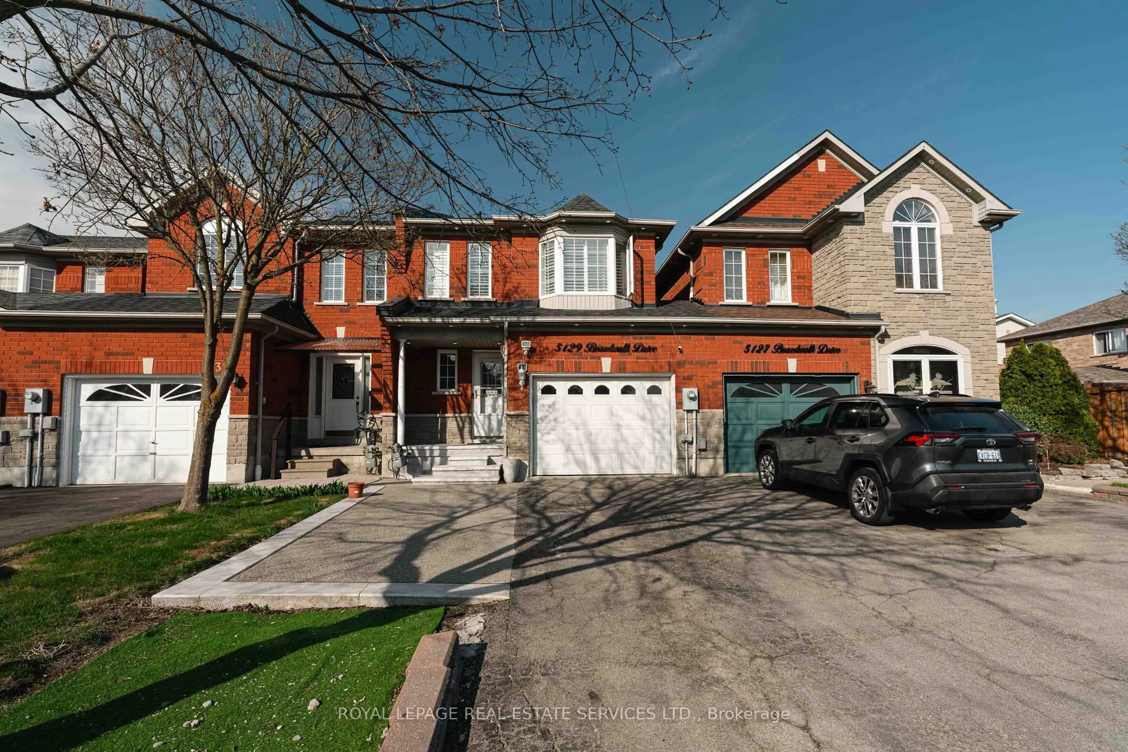 Home with brick exterior material, street for 5129 Boardwalk Dr, Mississauga Ontario L5R 3X7