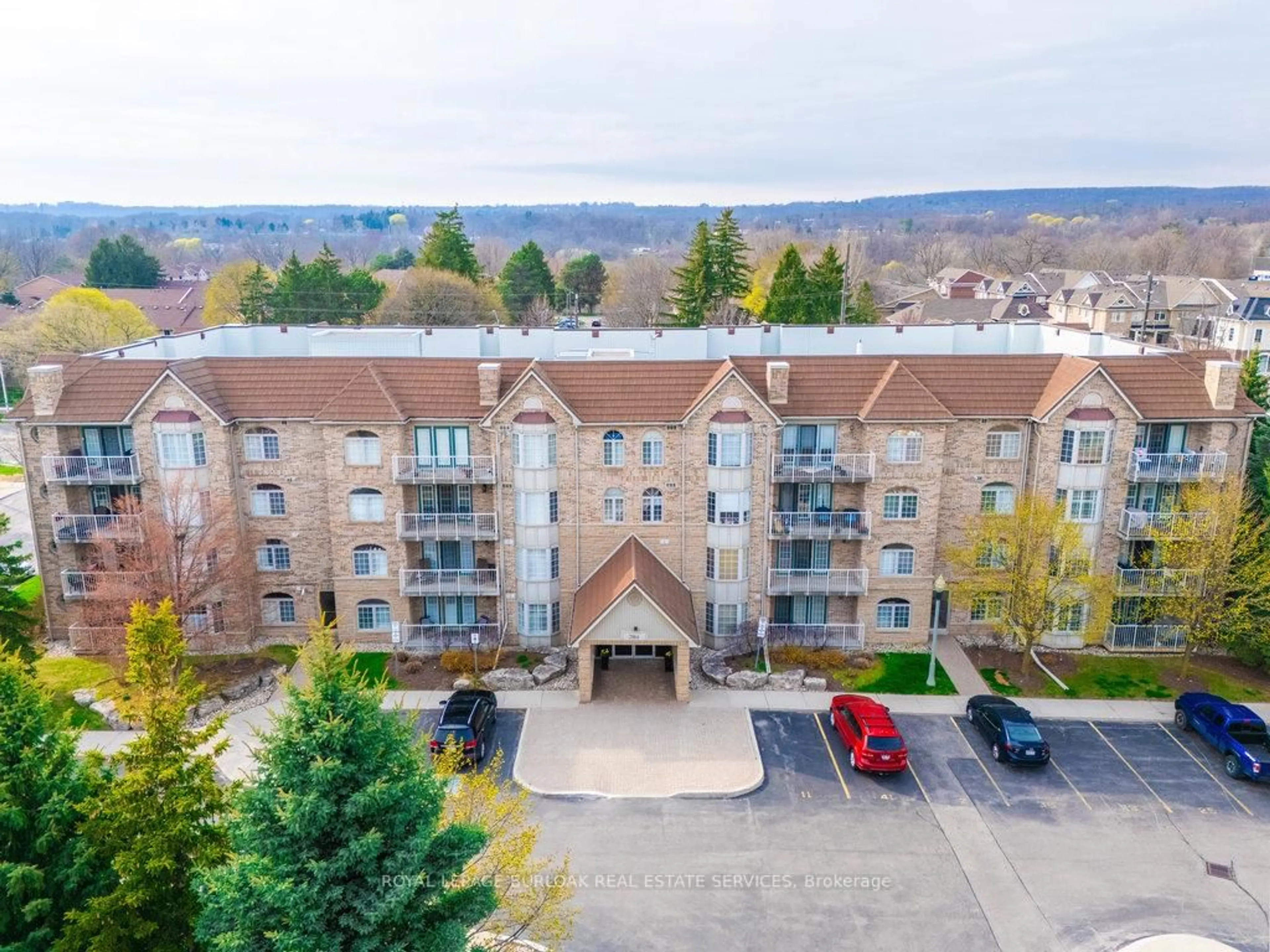 A pic from outside/outdoor area/front of a property/back of a property/a pic from drone, unknown for 216E Plains Rd #109, Burlington Ontario L7T 4L1