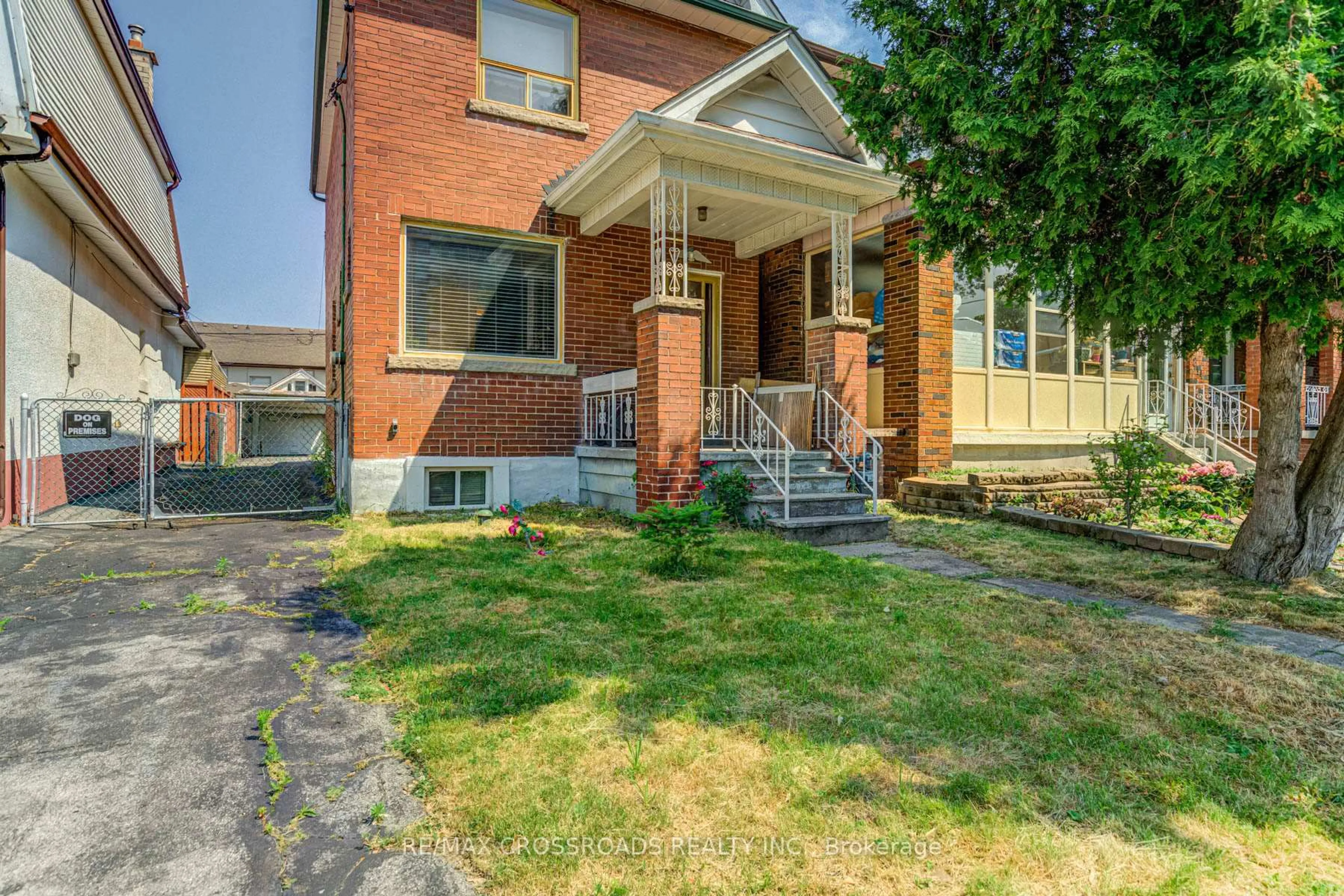 Home with brick exterior material, street for 216 Livingstone Ave, Toronto Ontario M6E 2M2