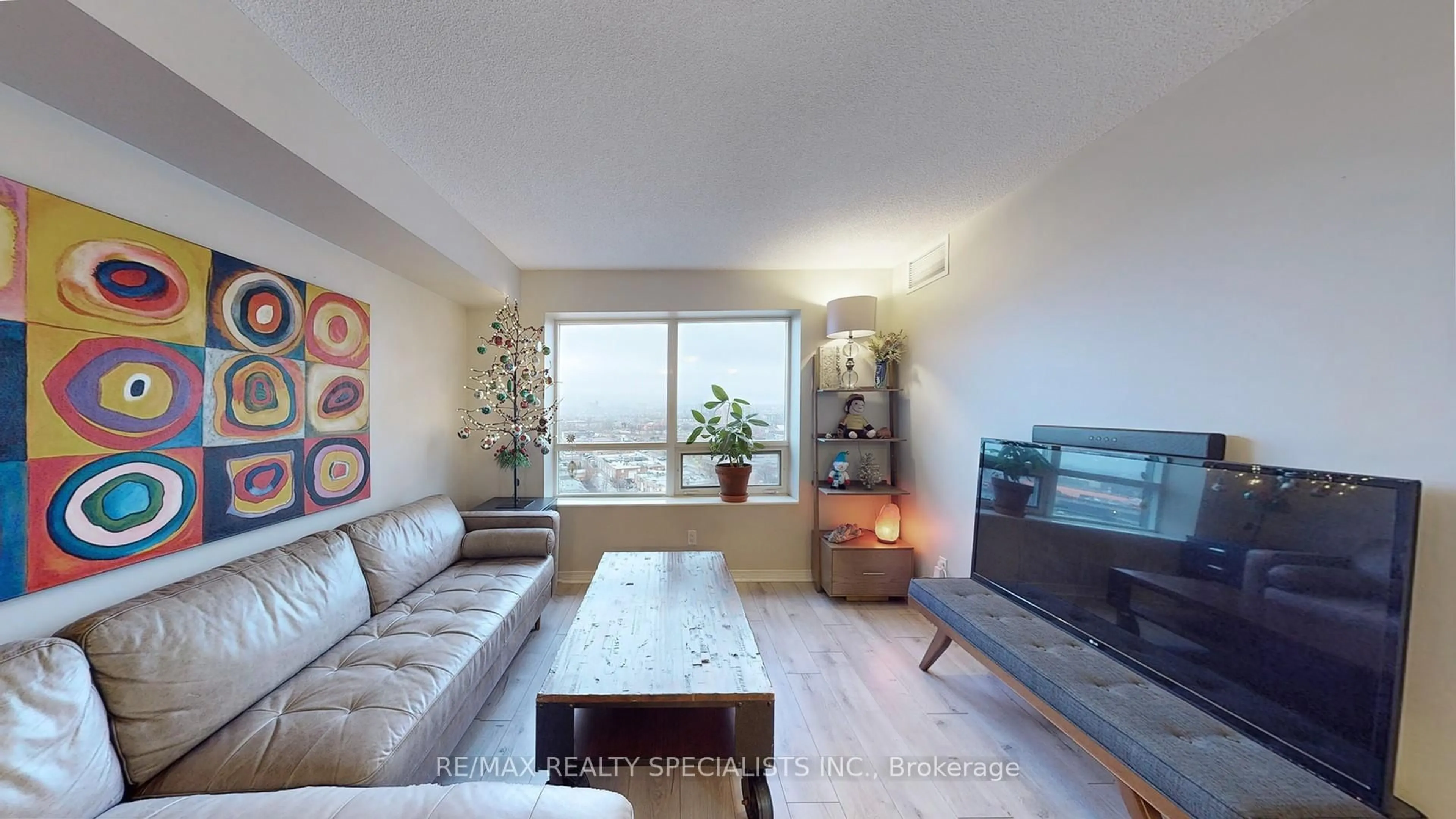 Living room with furniture, wood/laminate floor for 61 Heintzman St #1412, Toronto Ontario M6P 5A2