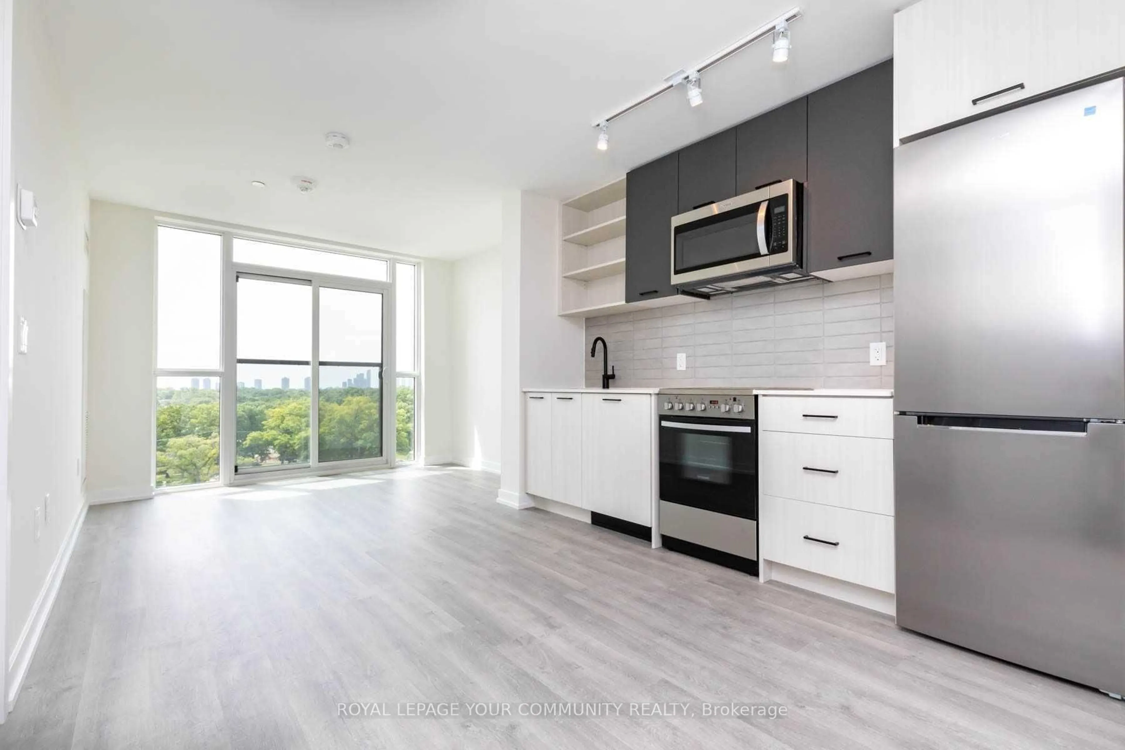 Open concept kitchen, wood/laminate floor for 2300 St Clair Ave #805, Toronto Ontario M6N 0B3