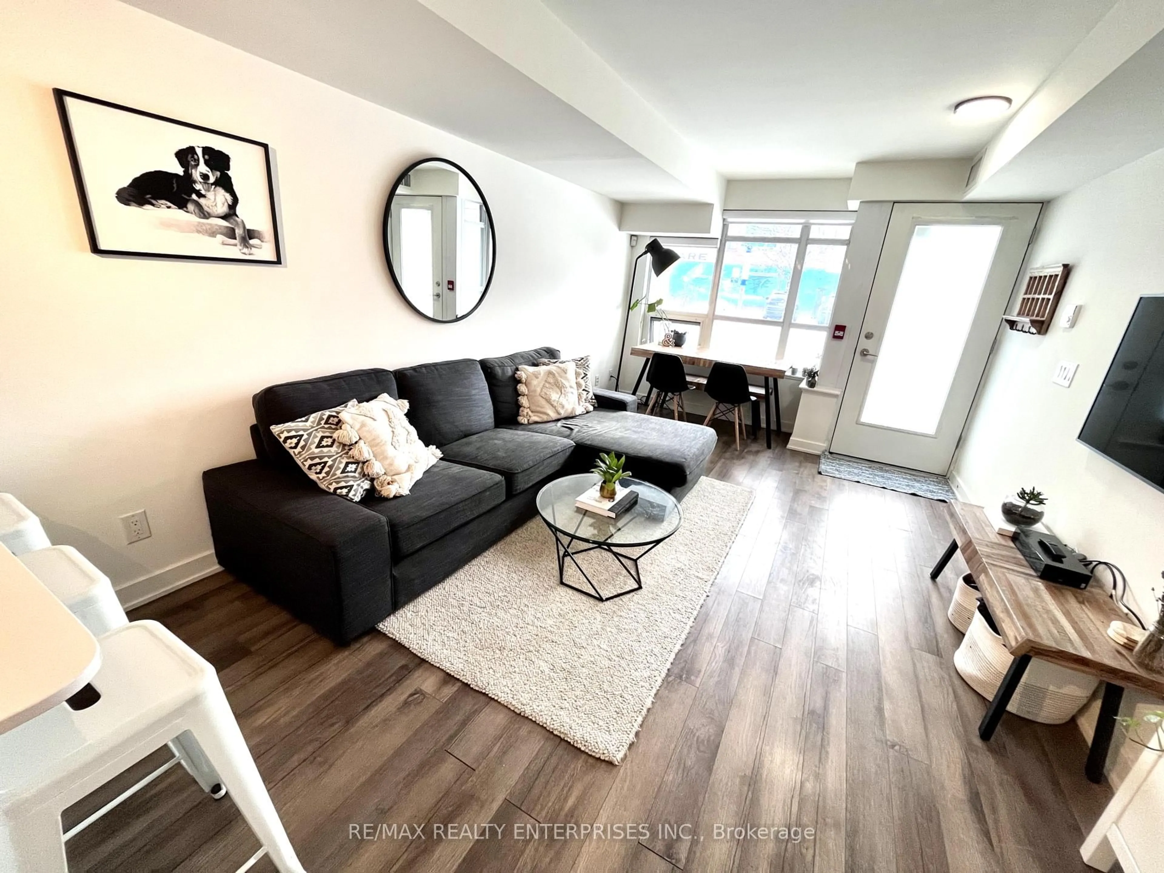 Living room with furniture, wood/laminate floor for 11 Superior Ave #TH1, Toronto Ontario M8V 0A7