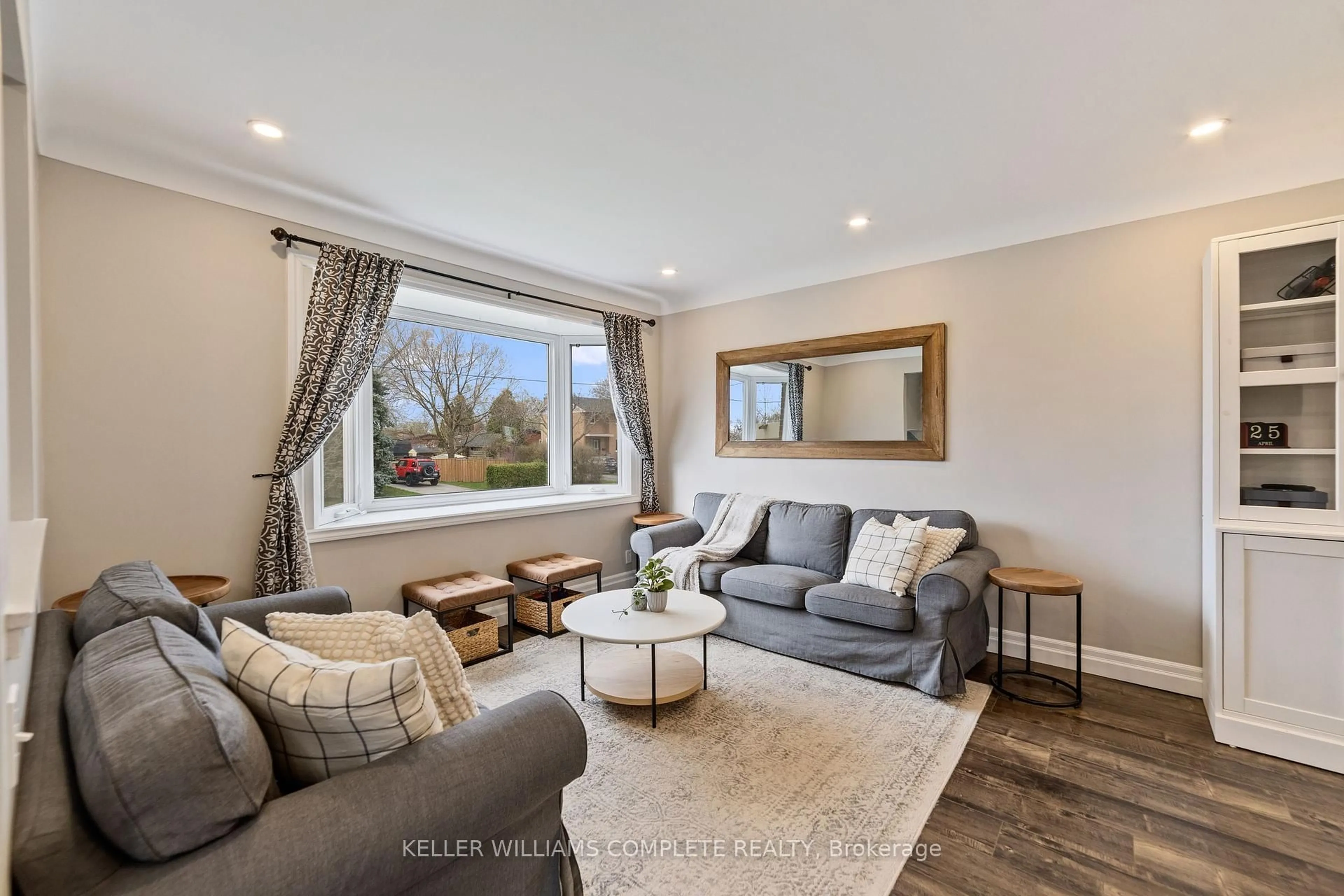 Living room with furniture, wood/laminate floor for 4529 Bennett Rd, Burlington Ontario L7L 1Y5