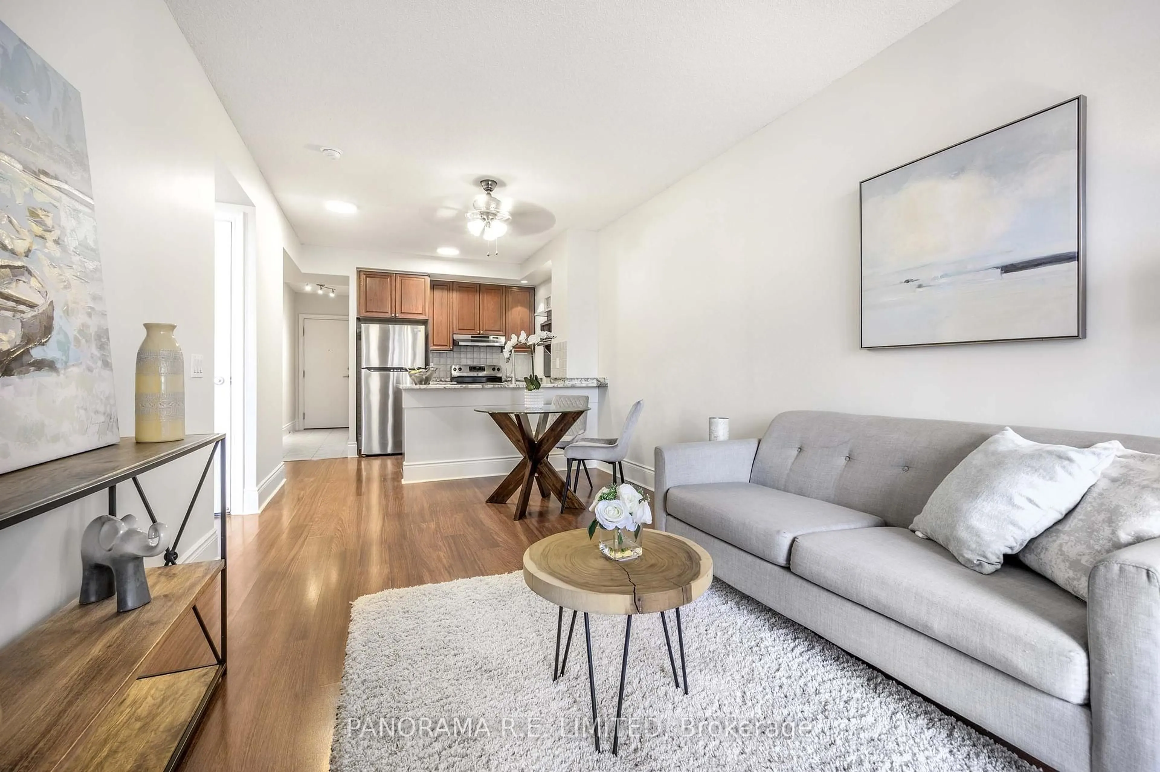 Living room with furniture, wood/laminate floor for 5233 Dundas St #1125, Toronto Ontario M9B 6M1