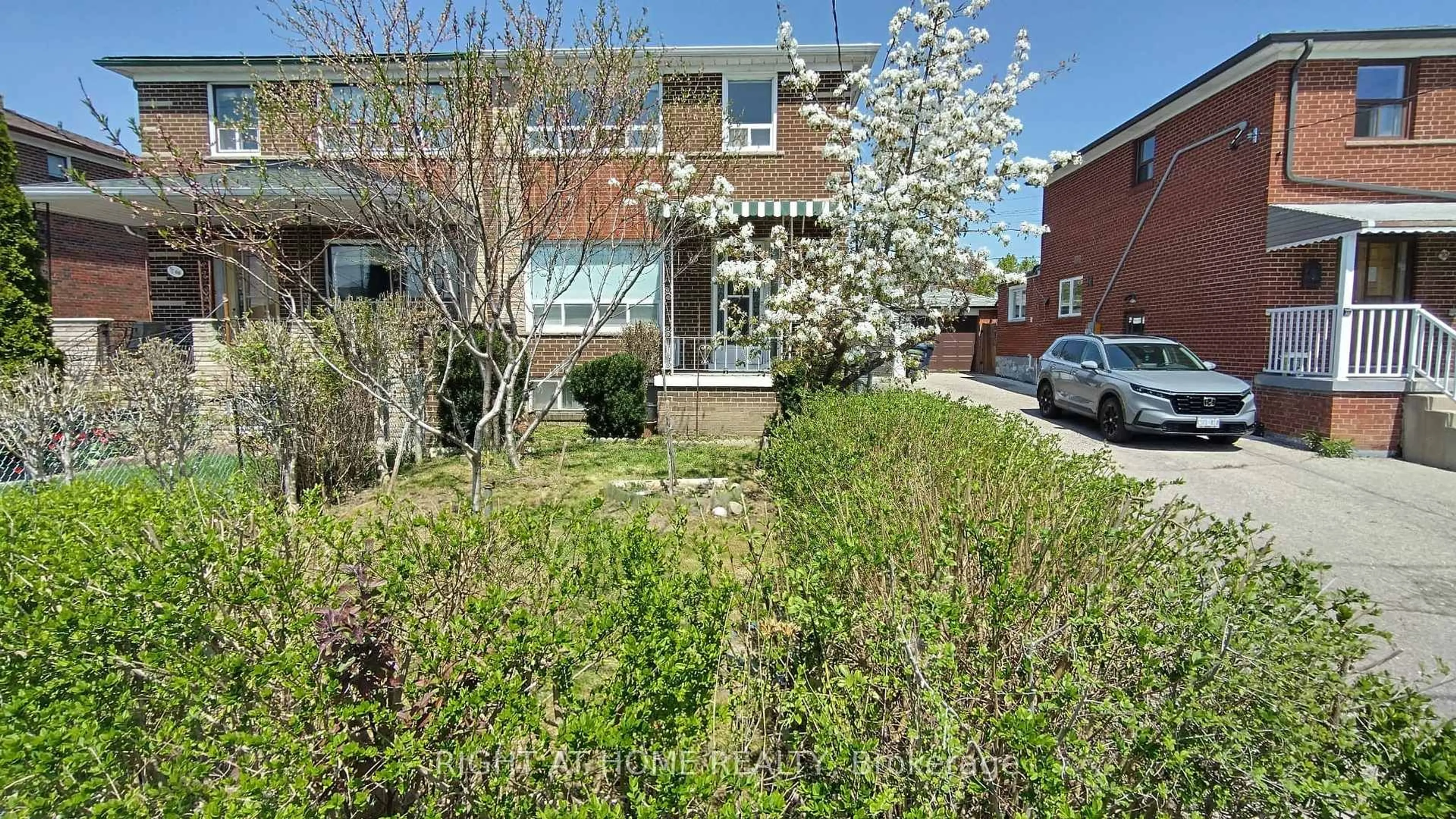 Home with brick exterior material, street for 68 Thurrock Rd, Toronto Ontario M3L 1P8