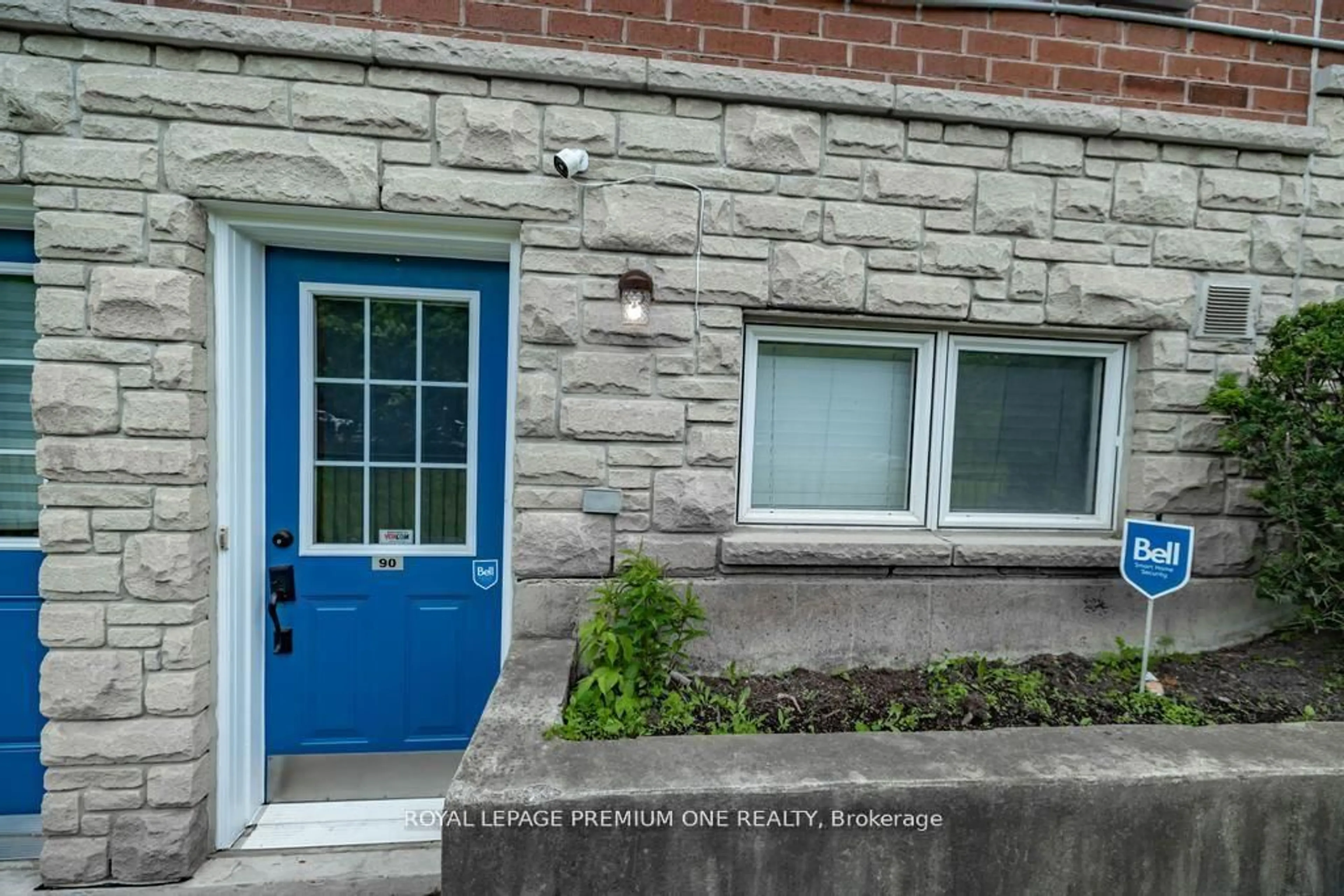 Home with brick exterior material, street for 65 Turntable Cres #90, Toronto Ontario M6H 4K8