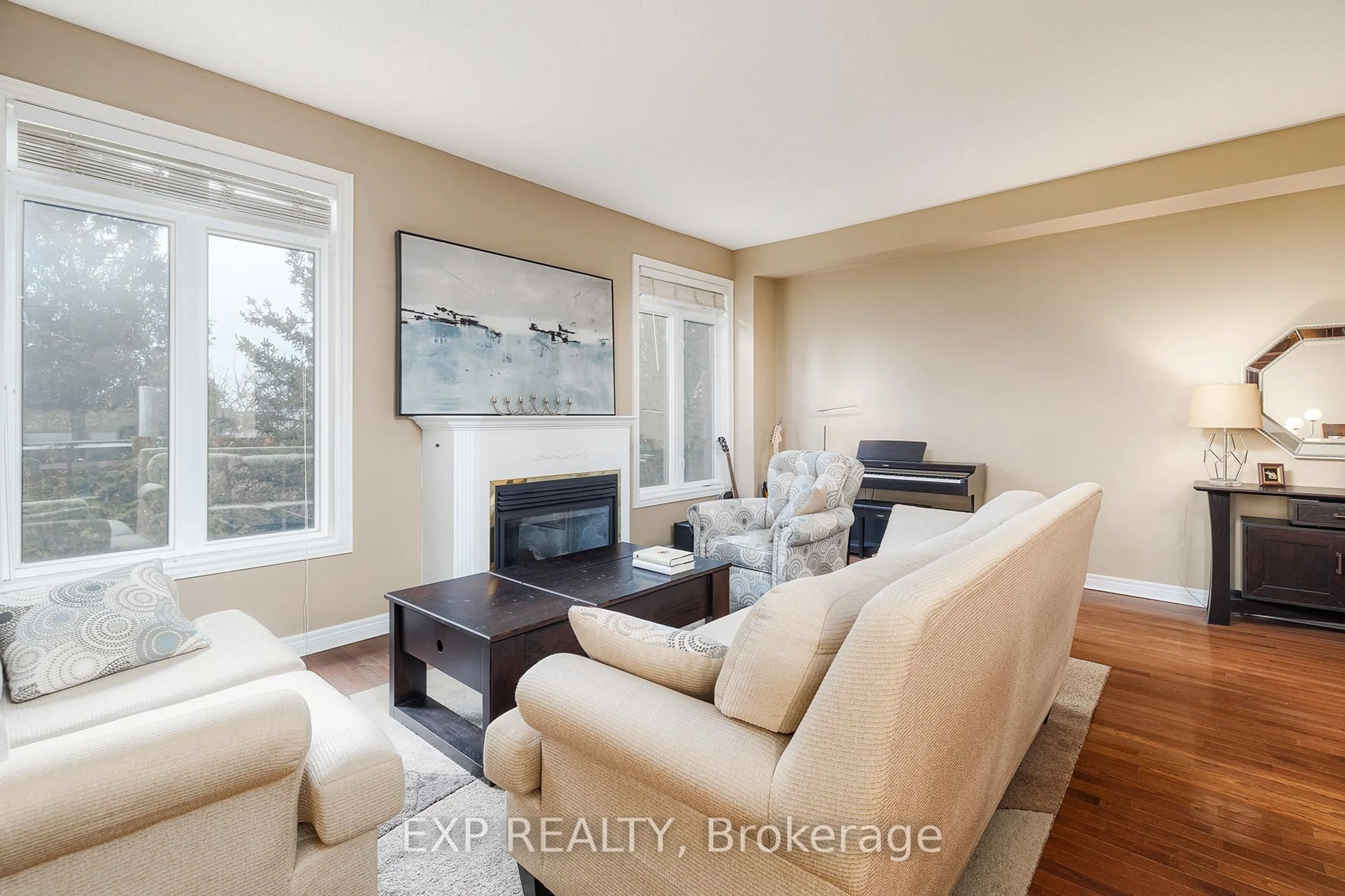 Living room with furniture, wood/laminate floor for 1169 Dorval Dr #70, Oakville Ontario L6M 4V8