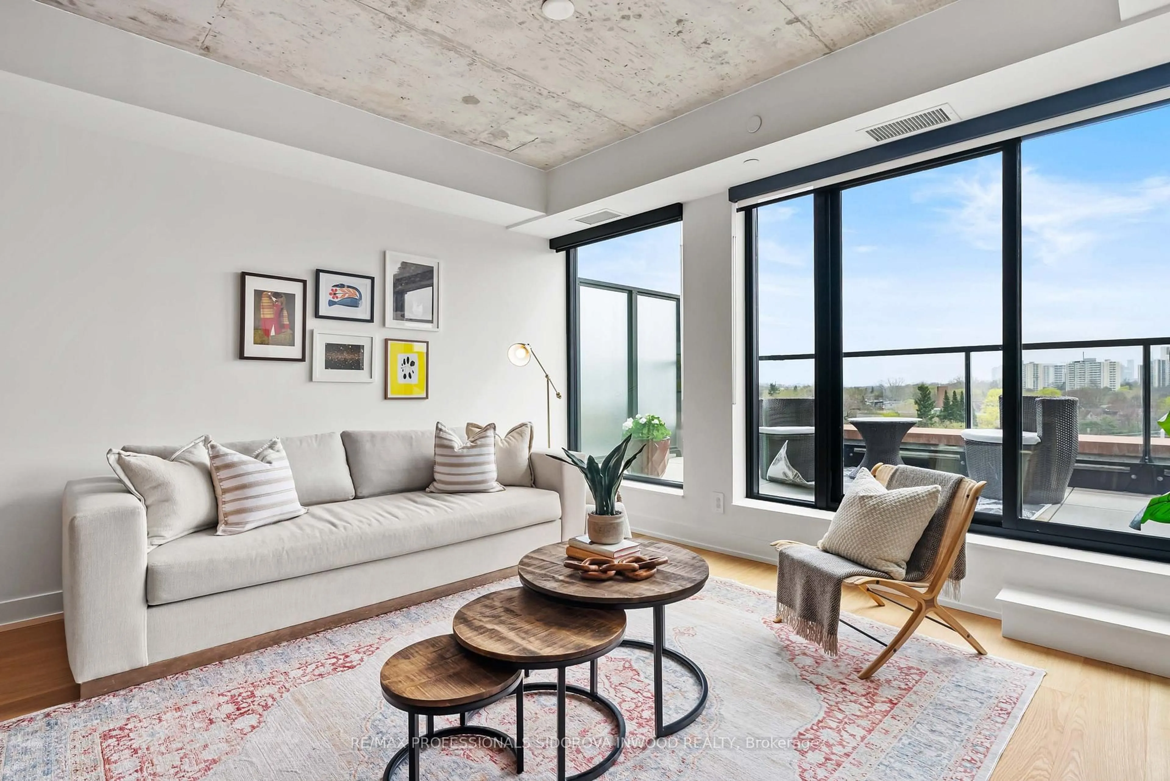 Living room with furniture, cement floor for 2720 Dundas St #606, Toronto Ontario M6P 1Y2