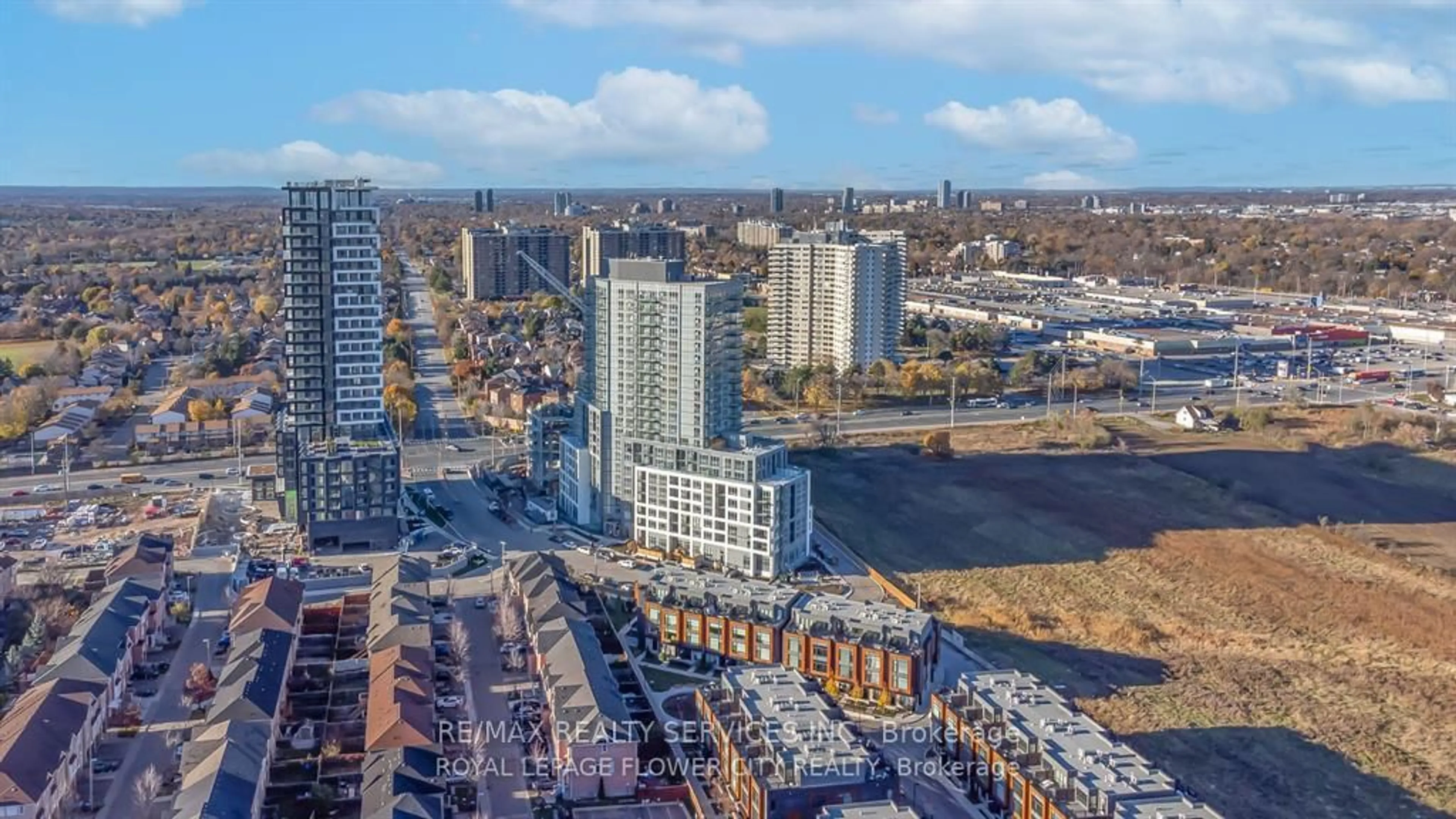 A pic from outside/outdoor area/front of a property/back of a property/a pic from drone, city buildings view from balcony for 225 Malta Ave #513, Brampton Ontario L6Y 6L6