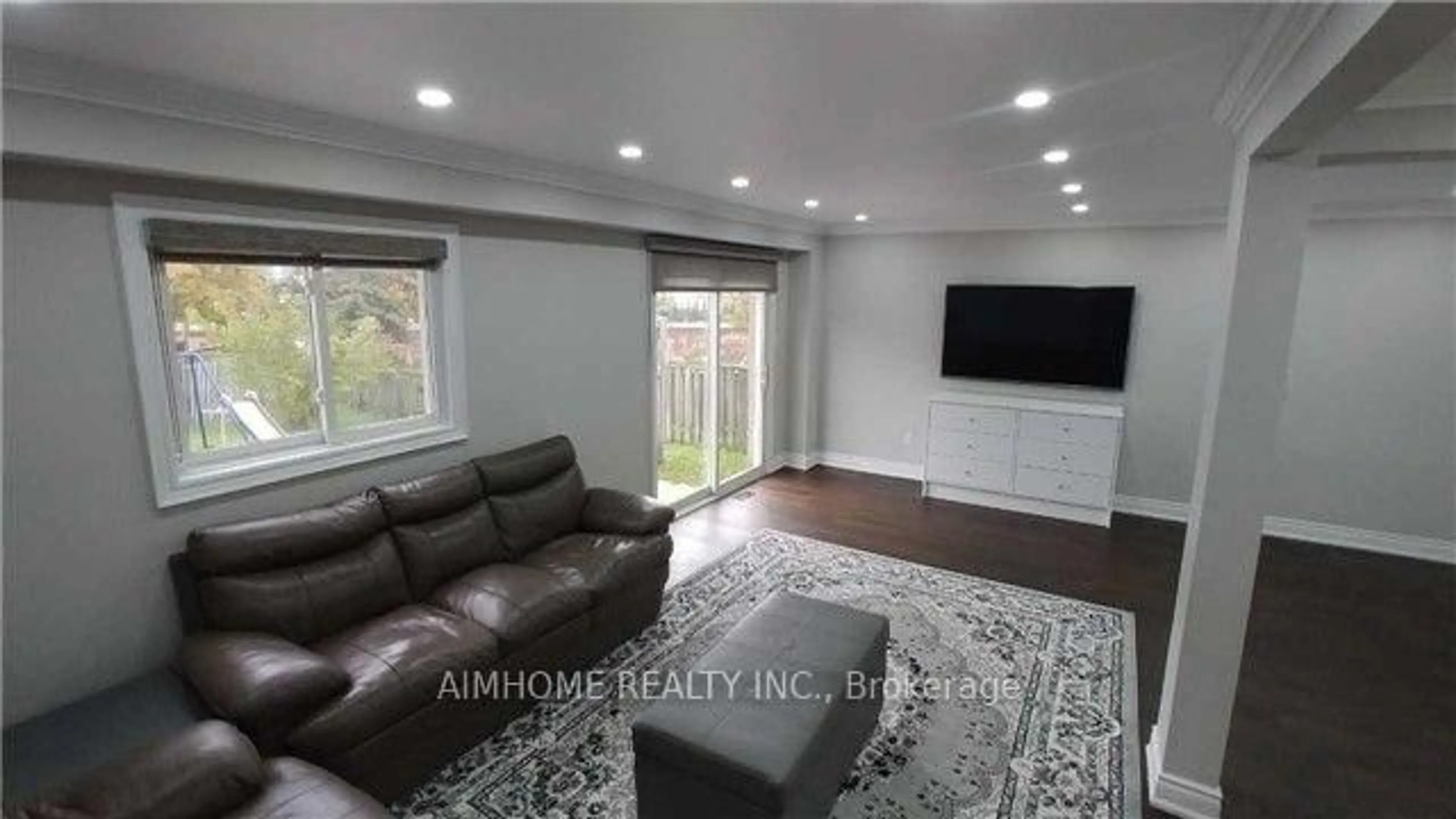Living room with furniture, wood/laminate floor for 655 Brougham Pl, Mississauga Ontario L5B 2Z5