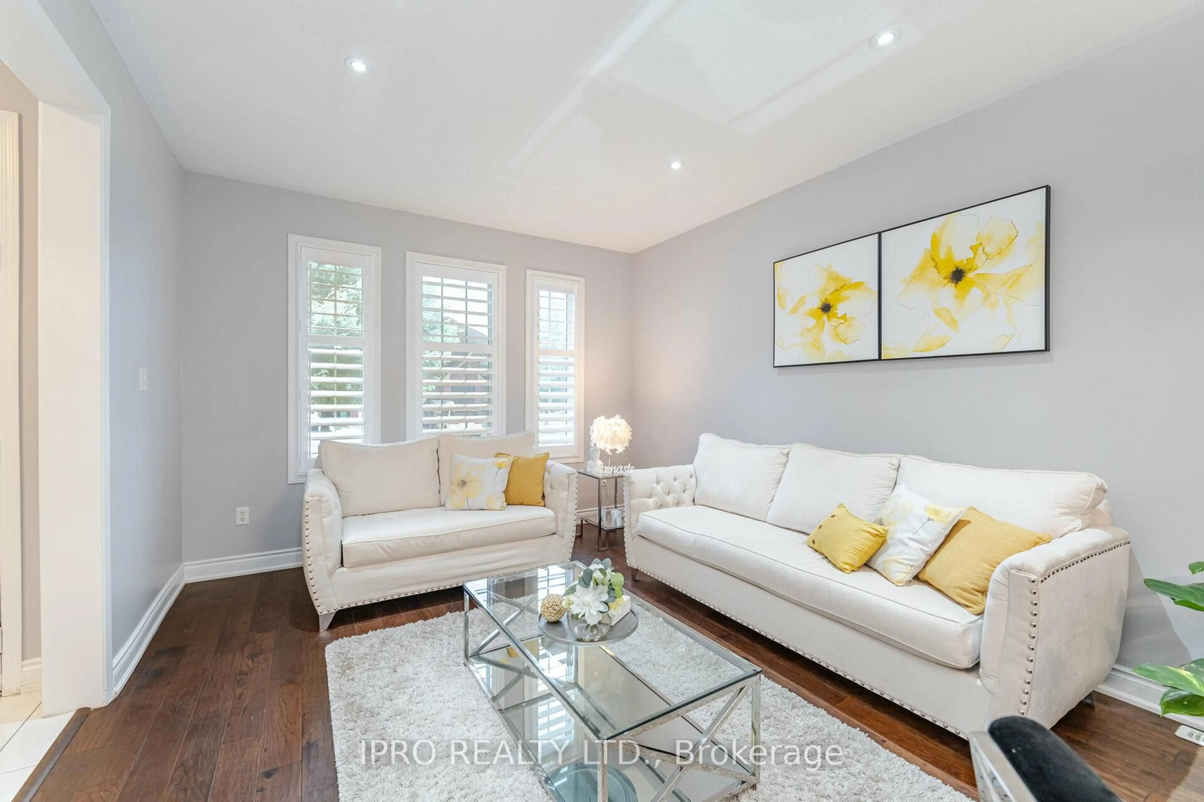 Living room with furniture, wood/laminate floor for 14 Valleywest Rd, Brampton Ontario L6P 2J9
