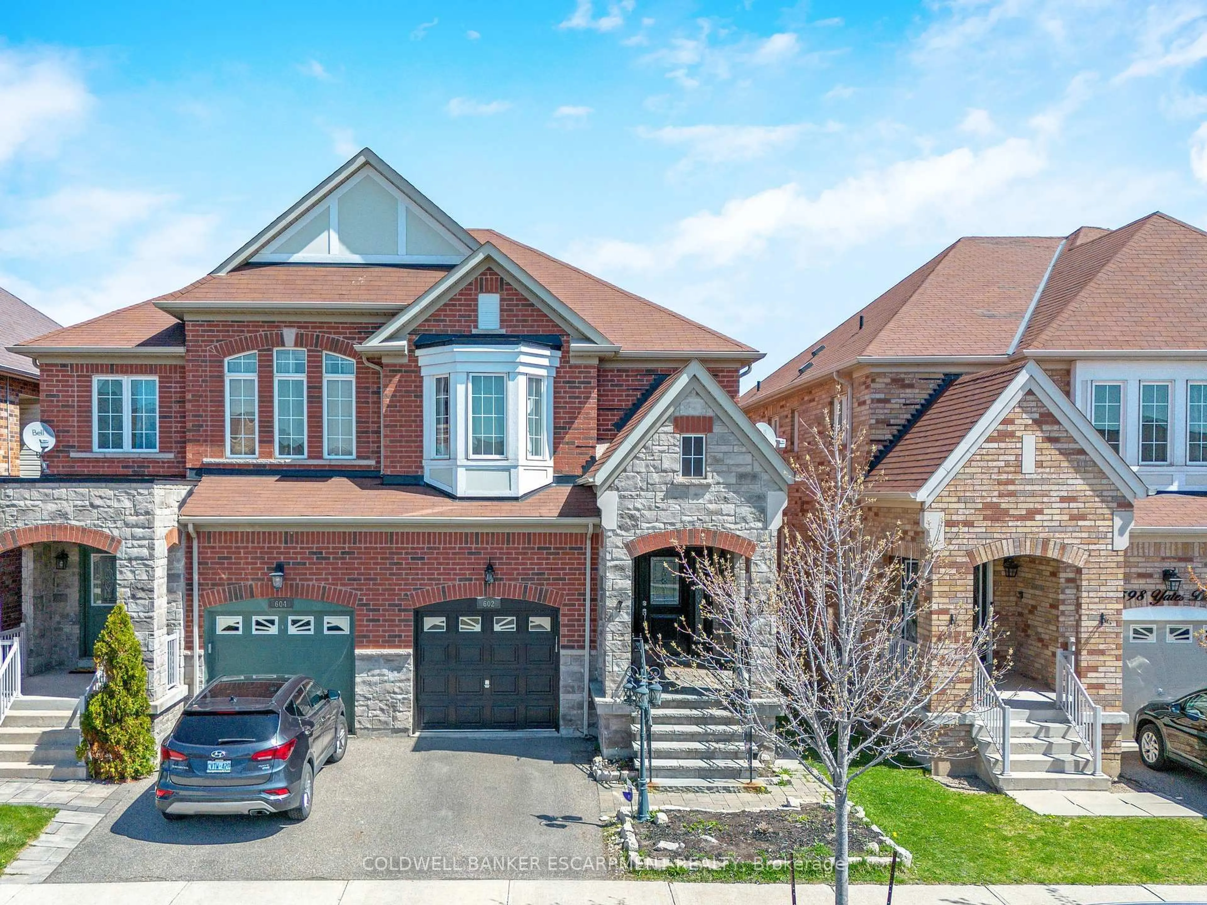 Home with brick exterior material, street for 602 Yates Dr, Milton Ontario L9T 7R1
