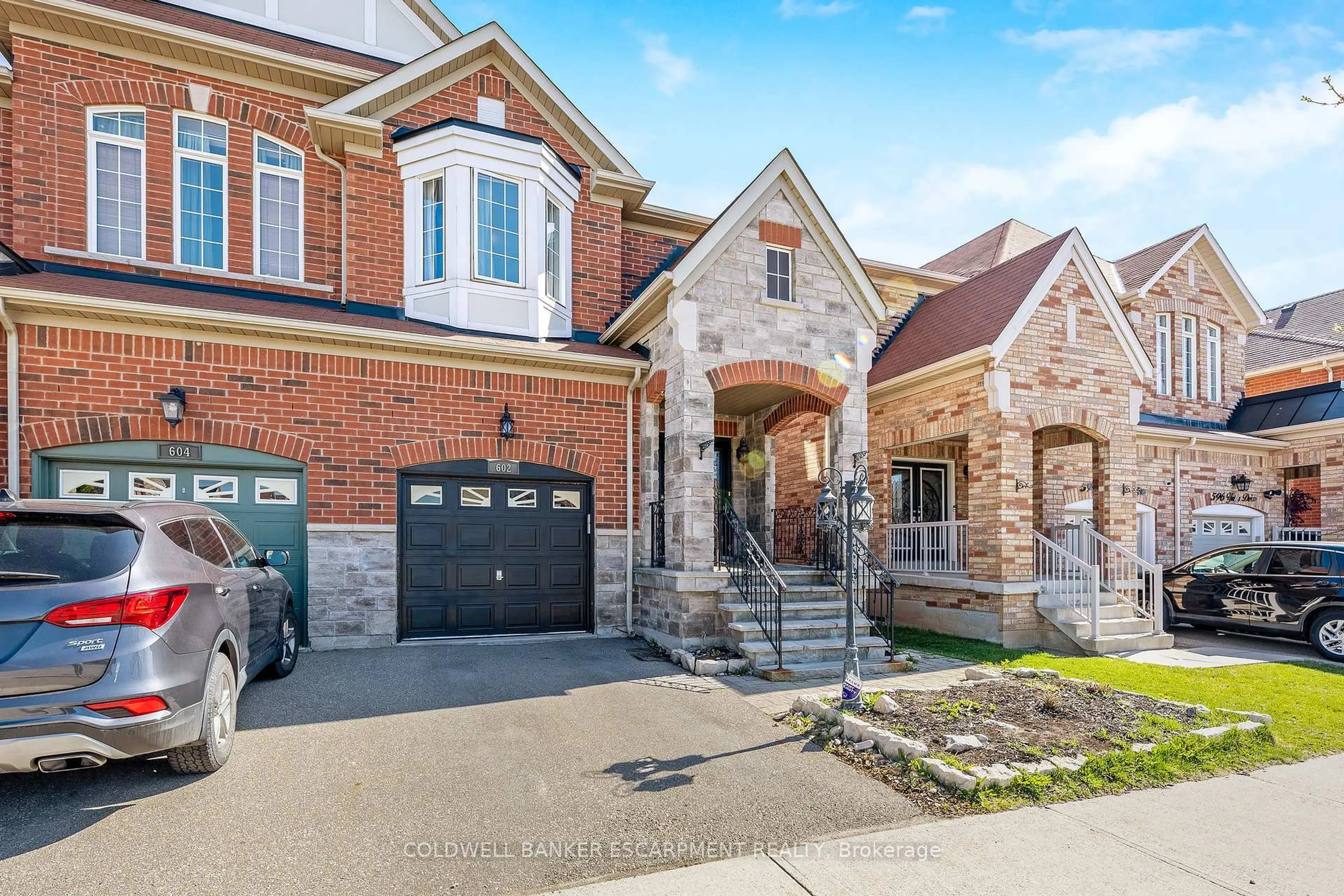 Home with brick exterior material, street for 602 Yates Dr, Milton Ontario L9T 7R1