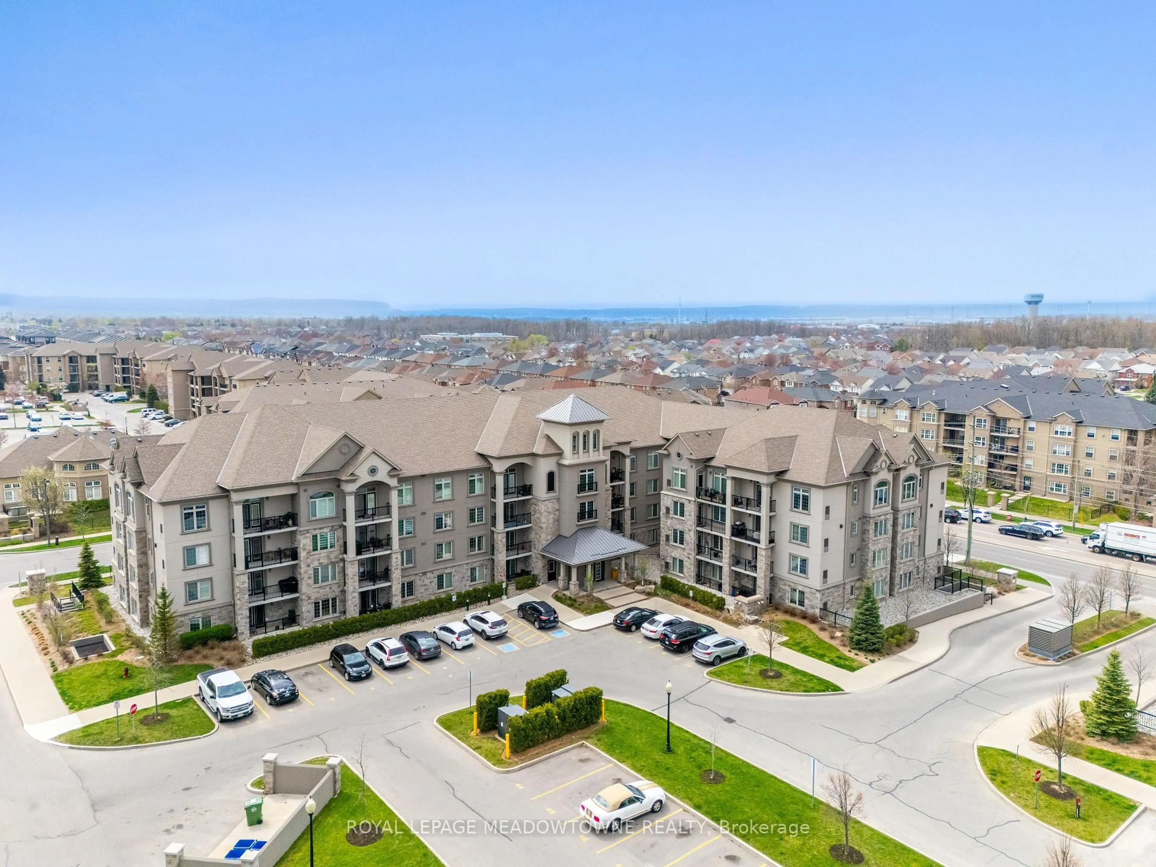 A pic from outside/outdoor area/front of a property/back of a property/a pic from drone, unknown for 1440 Main St #415, Milton Ontario L9T 8W3