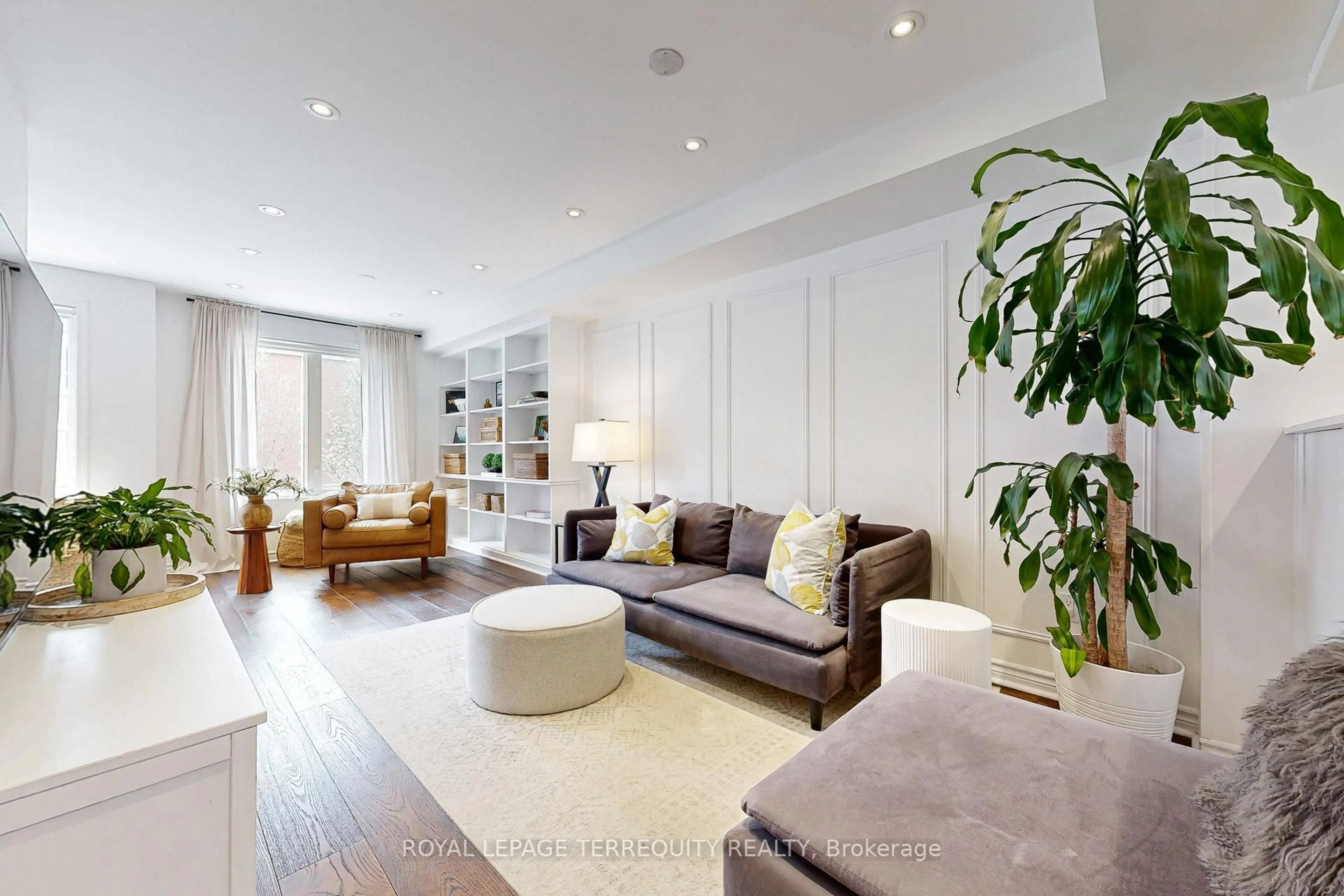 Living room with furniture, wood/laminate floor for 25 Laidlaw St #511, Toronto Ontario M6K 1X3